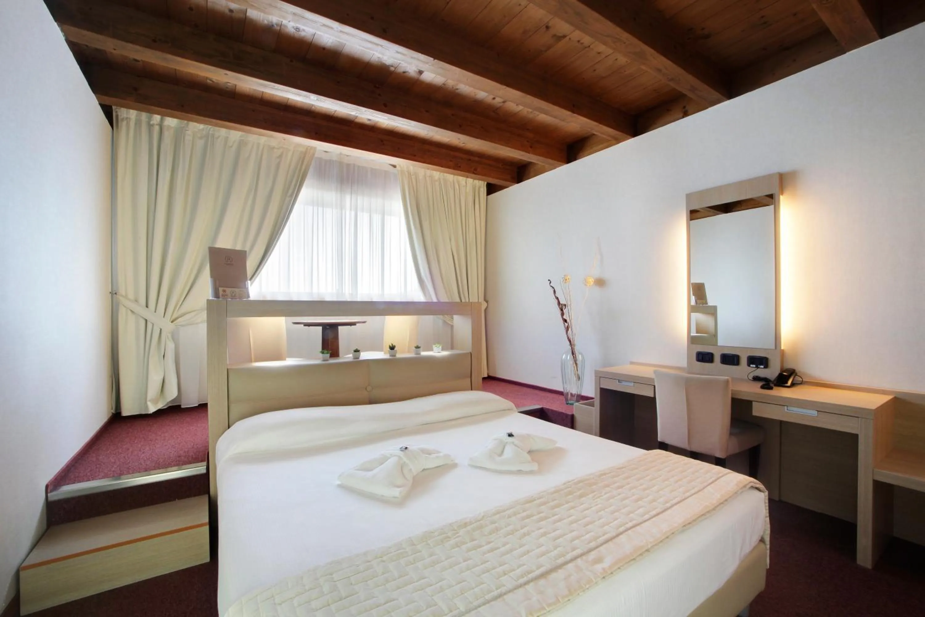 Bed in Cocca Hotel Royal Thai Spa