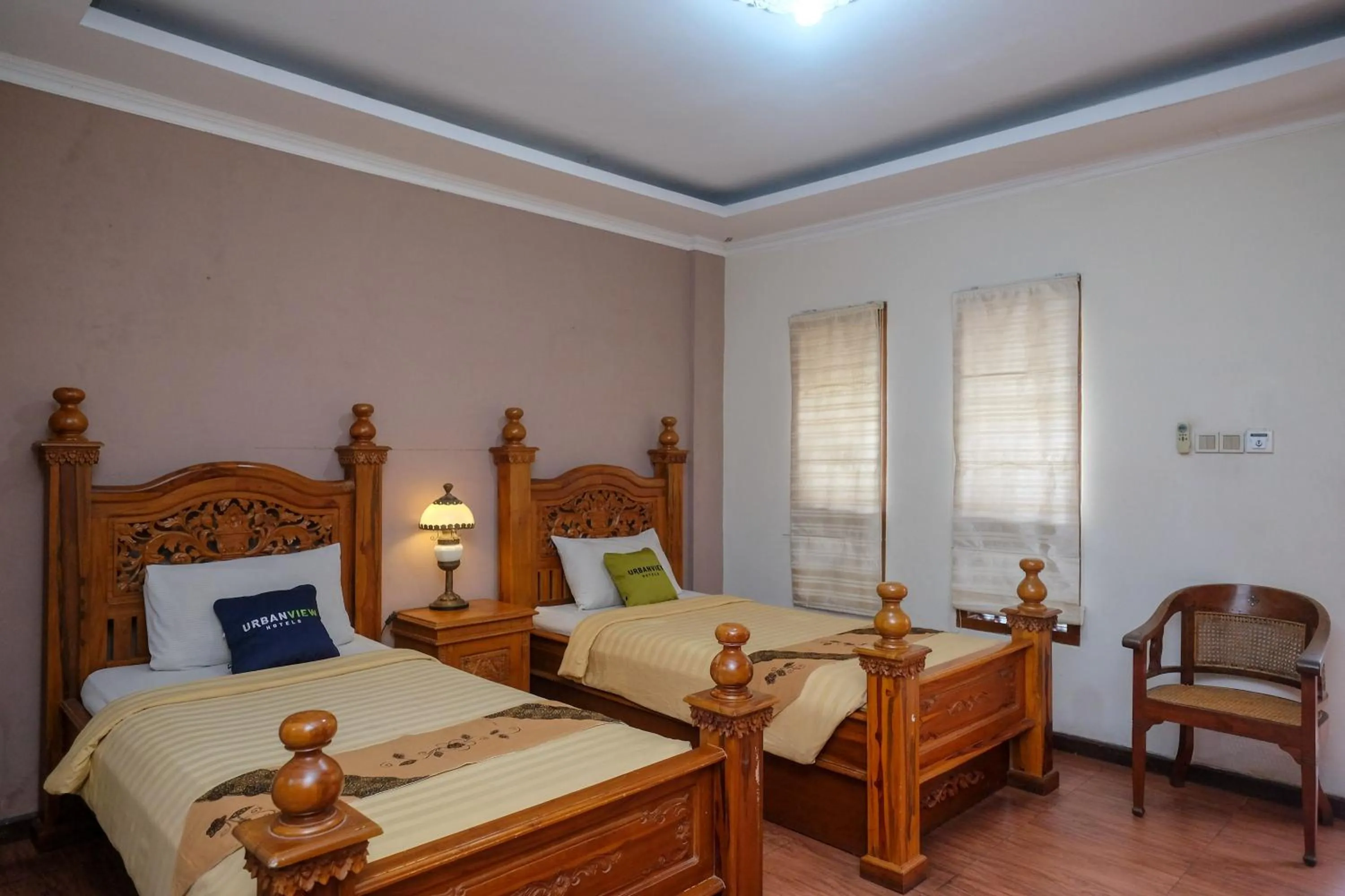 Bedroom, Bed in Urbanview Omah Eka Santi by RedDoorz