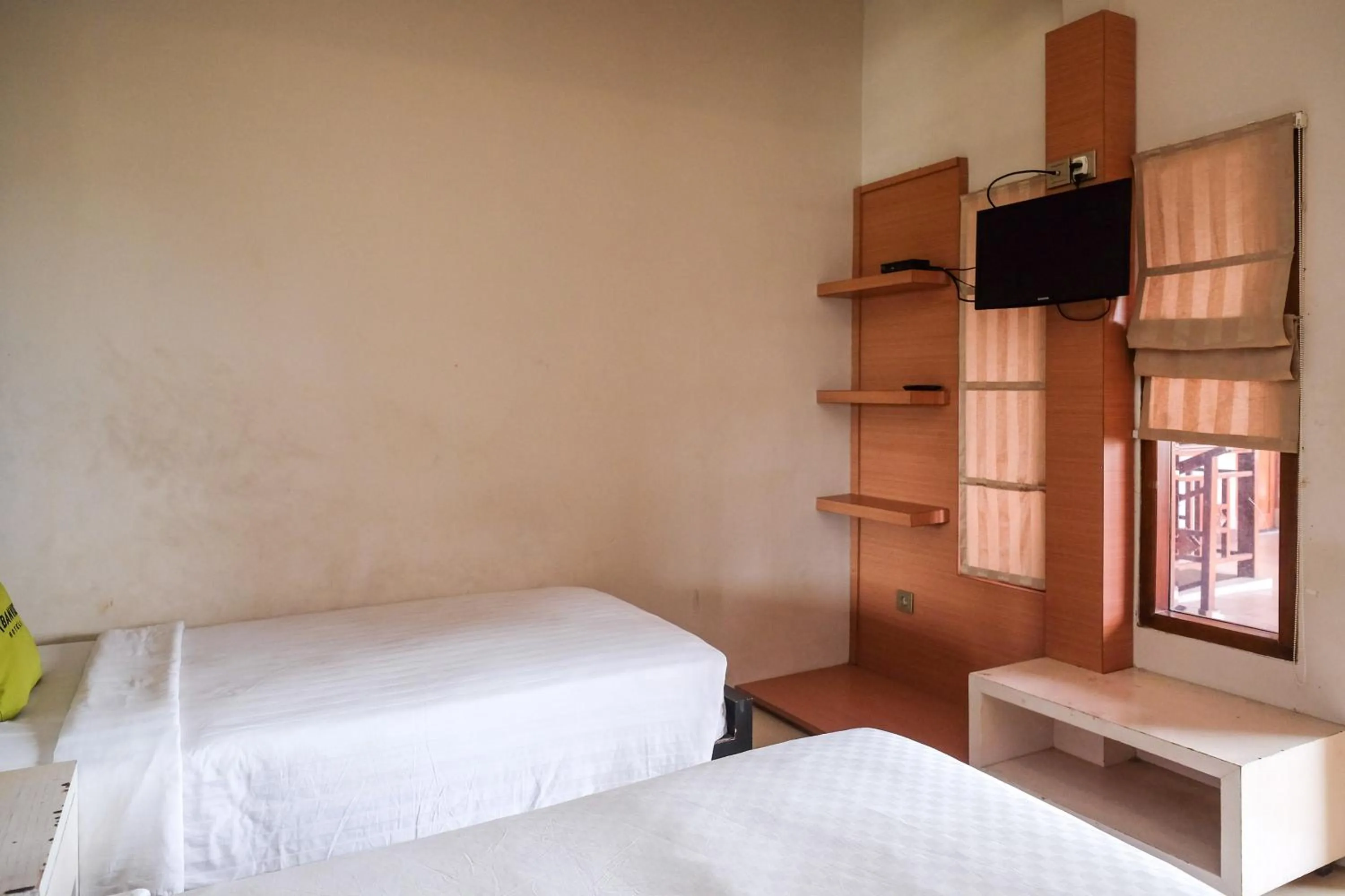 Bedroom, Bed in Urbanview Omah Eka Santi by RedDoorz