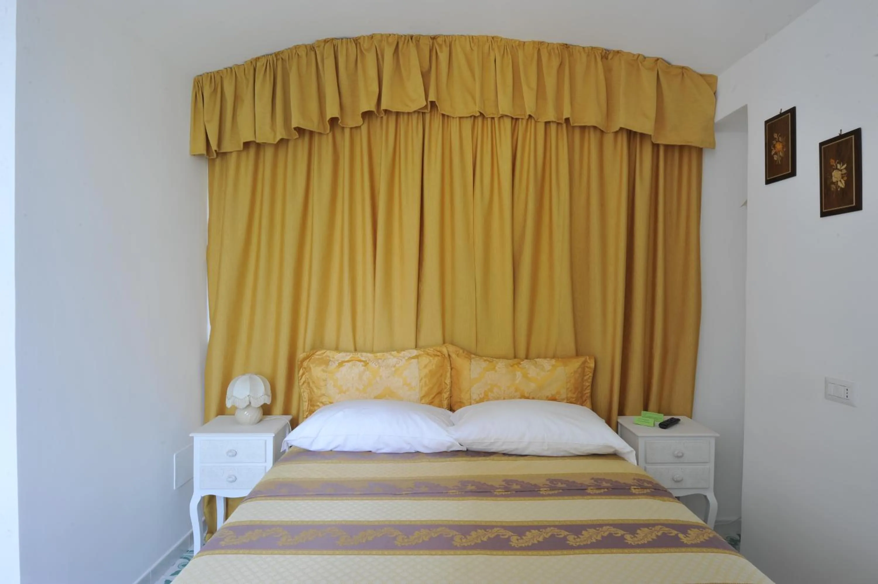 Bed in Surriento Suites