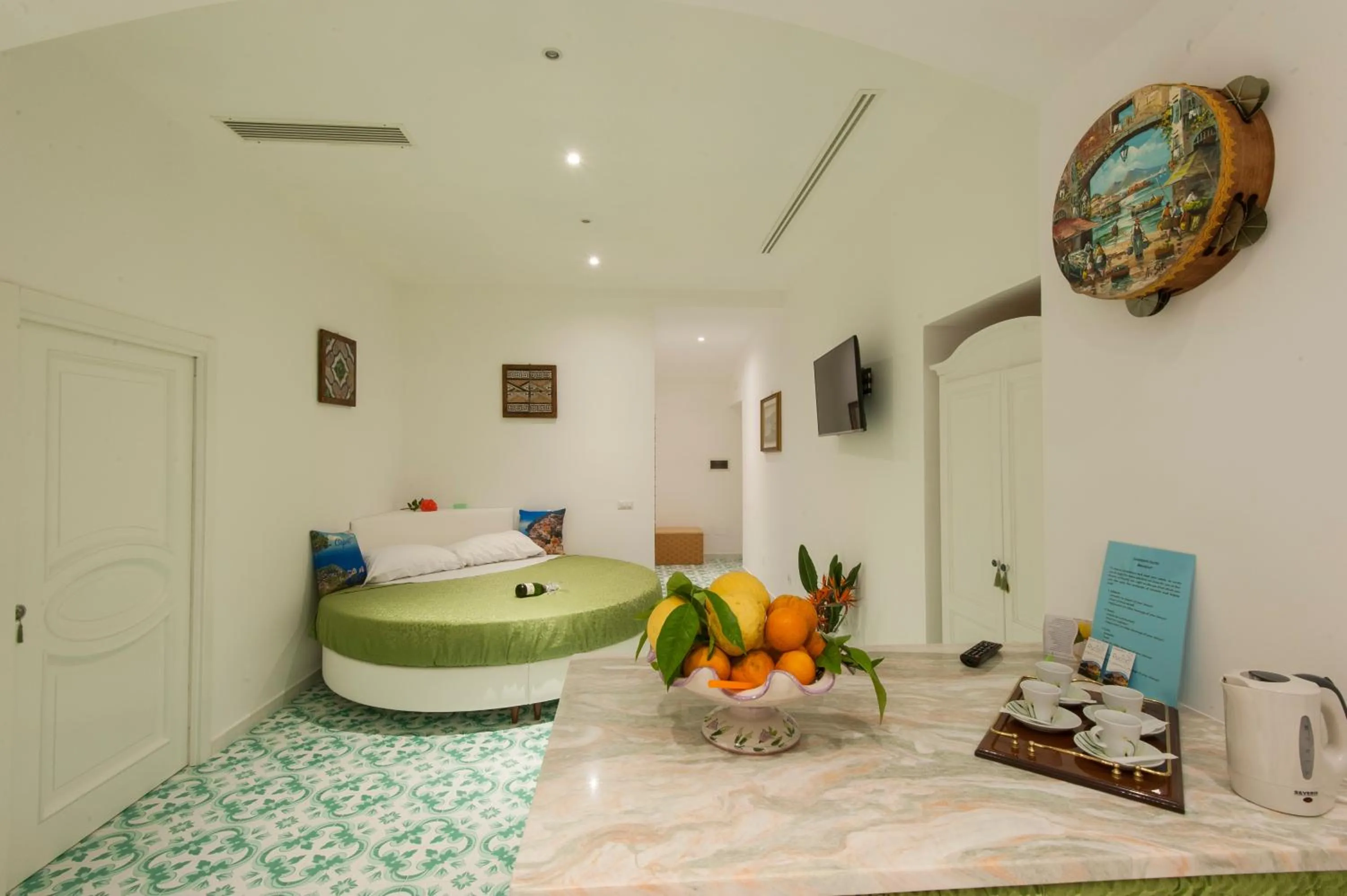 Bed in Surriento Suites