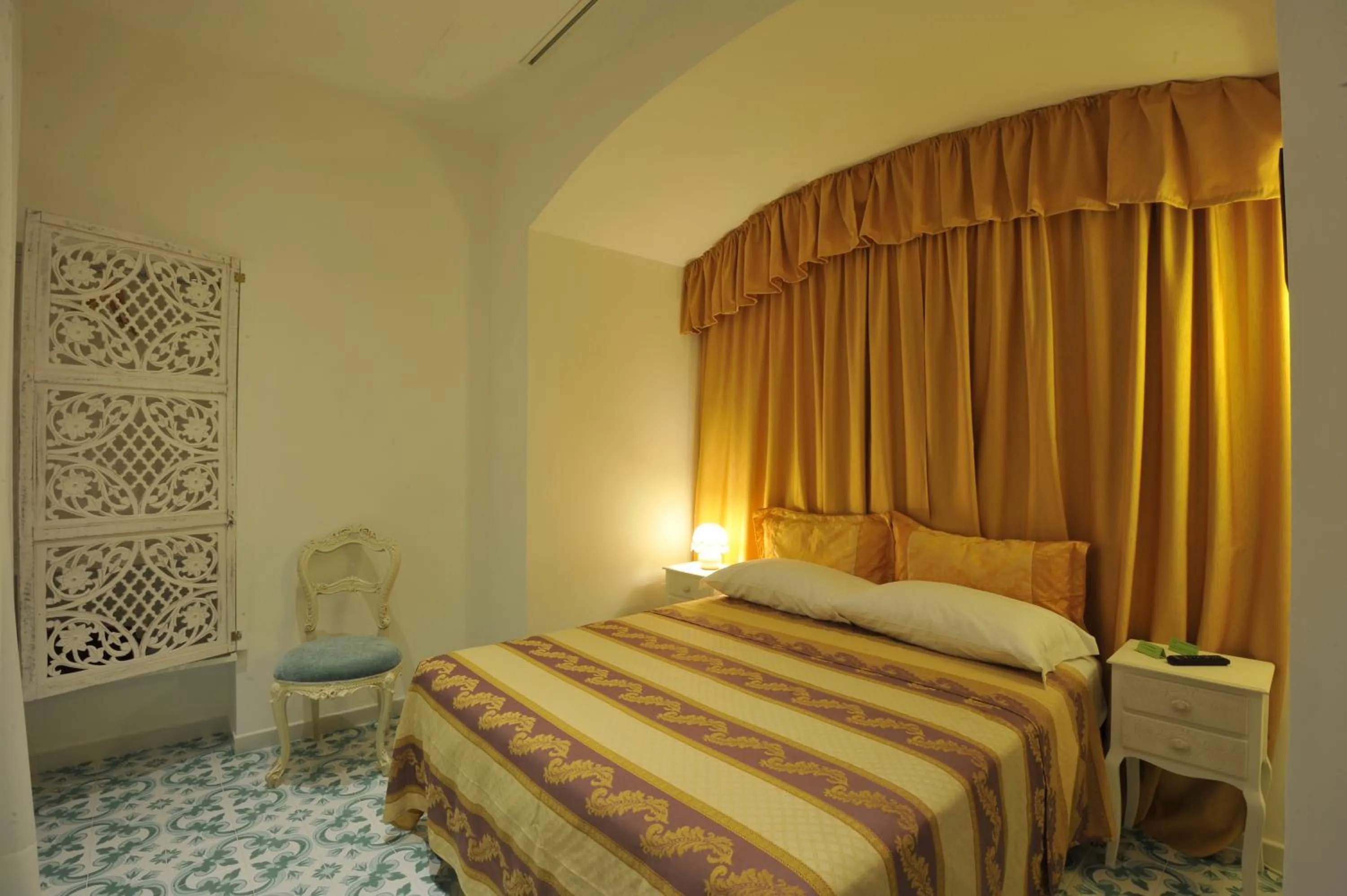 Bed in Surriento Suites