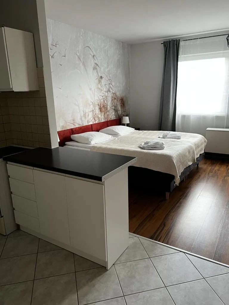 Bed in Delta Apart-House