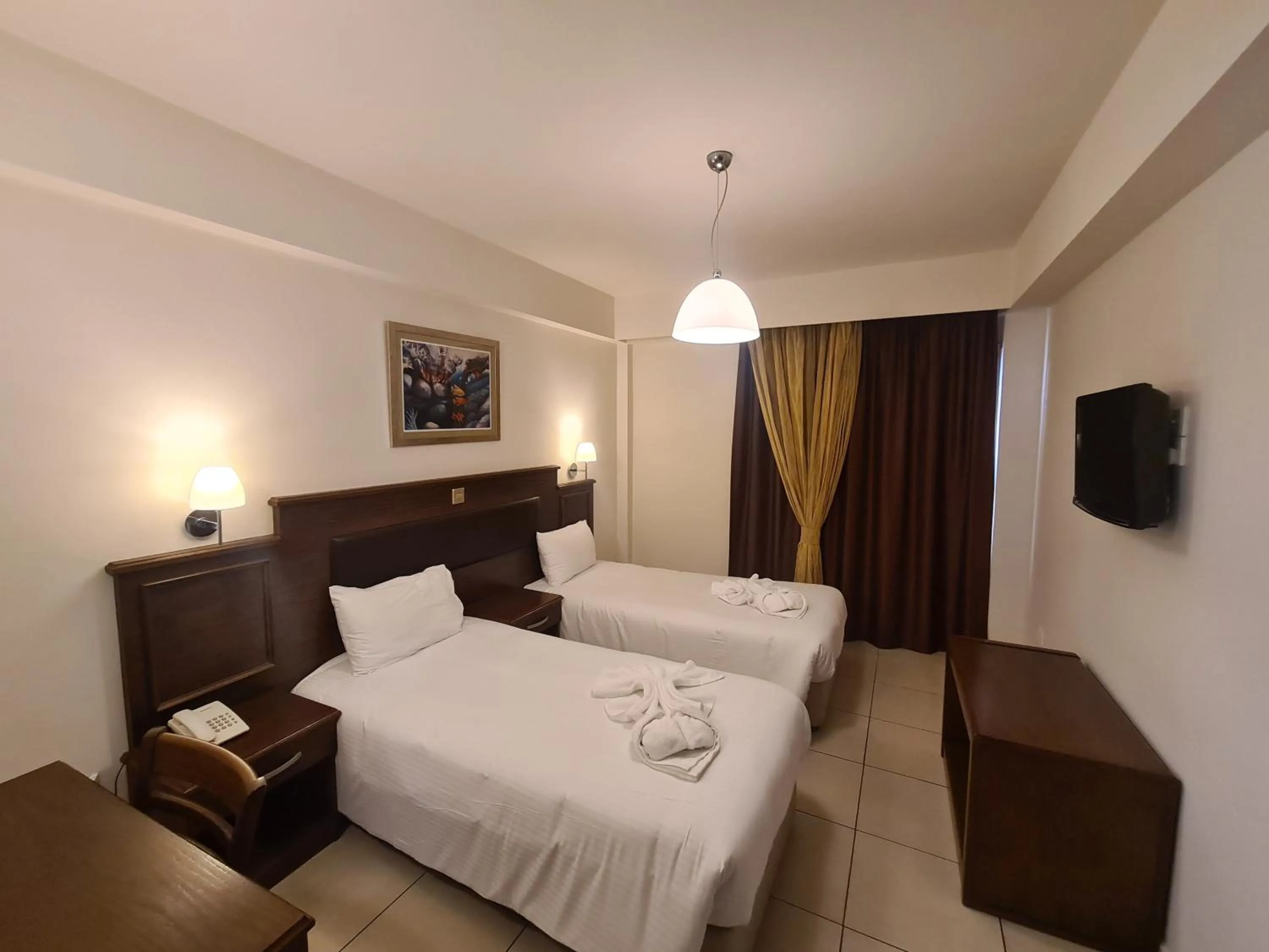 Bed in Euronapa Hotel Apartments