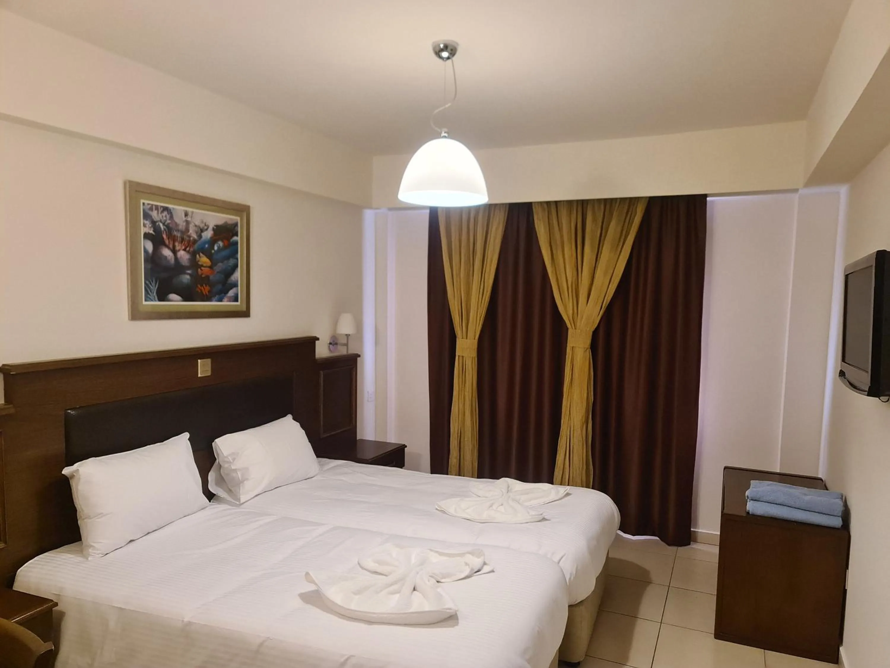 Bed in Euronapa Hotel Apartments