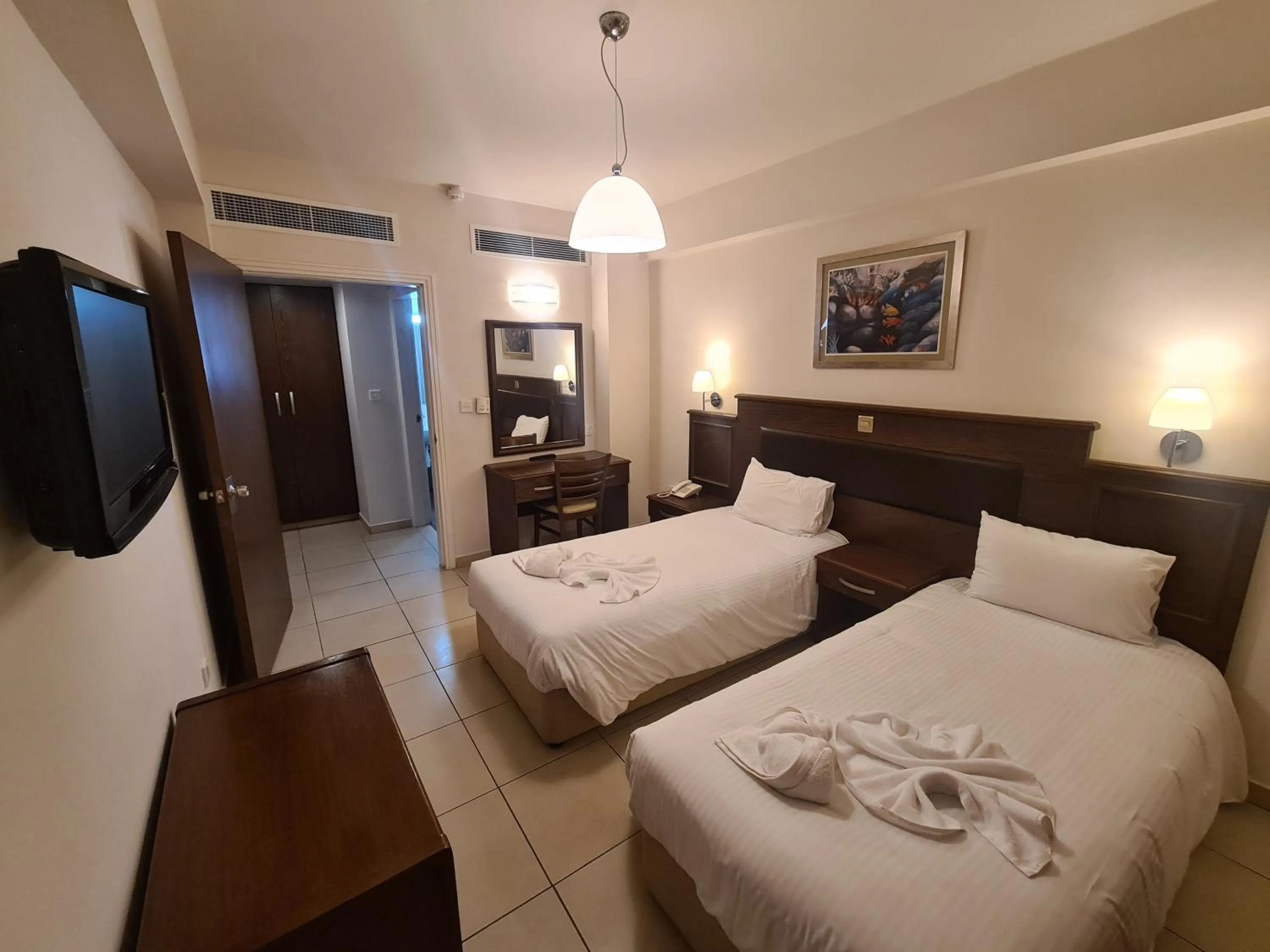 Bed in Euronapa Hotel Apartments