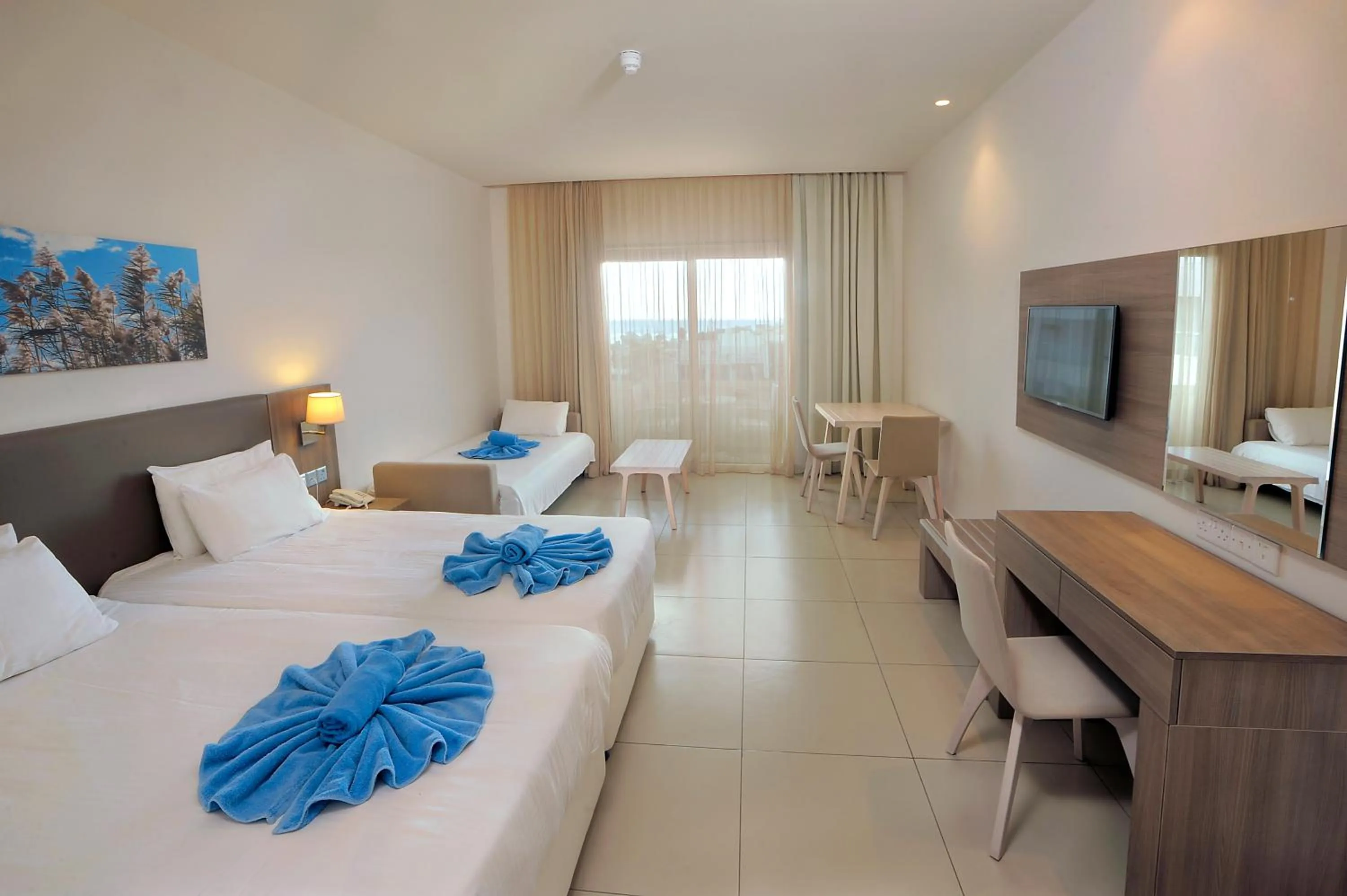 Bed in Euronapa Hotel Apartments