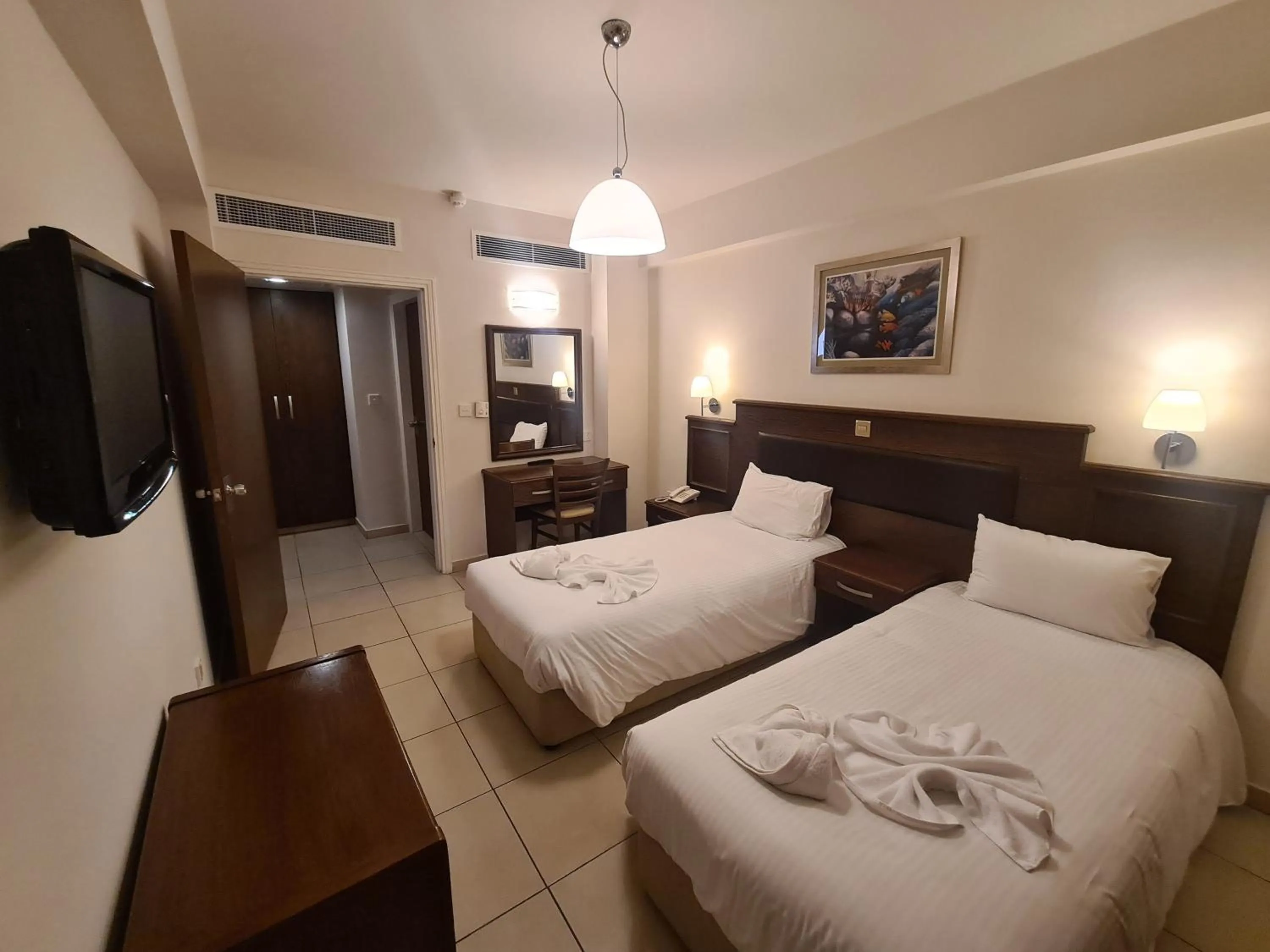 Bed in Euronapa Hotel Apartments