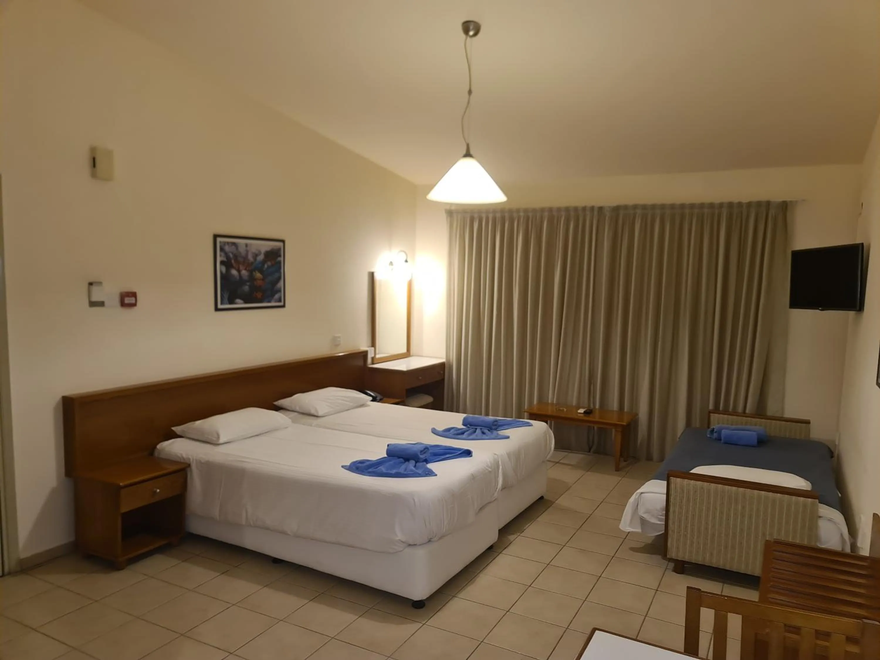 Bed in Nissiana Hotel & Bungalows