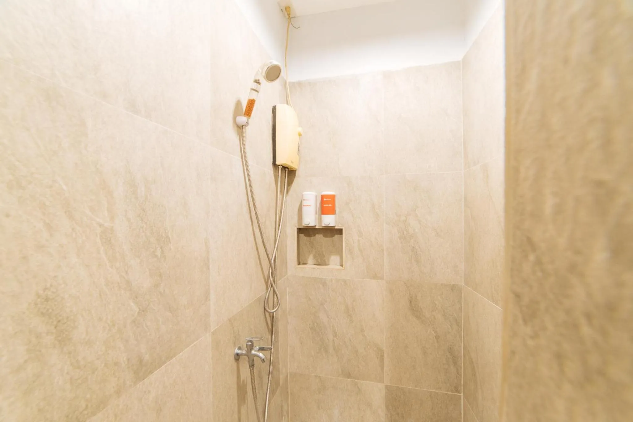 Shower in RedDoorz at Nirvana Pension House