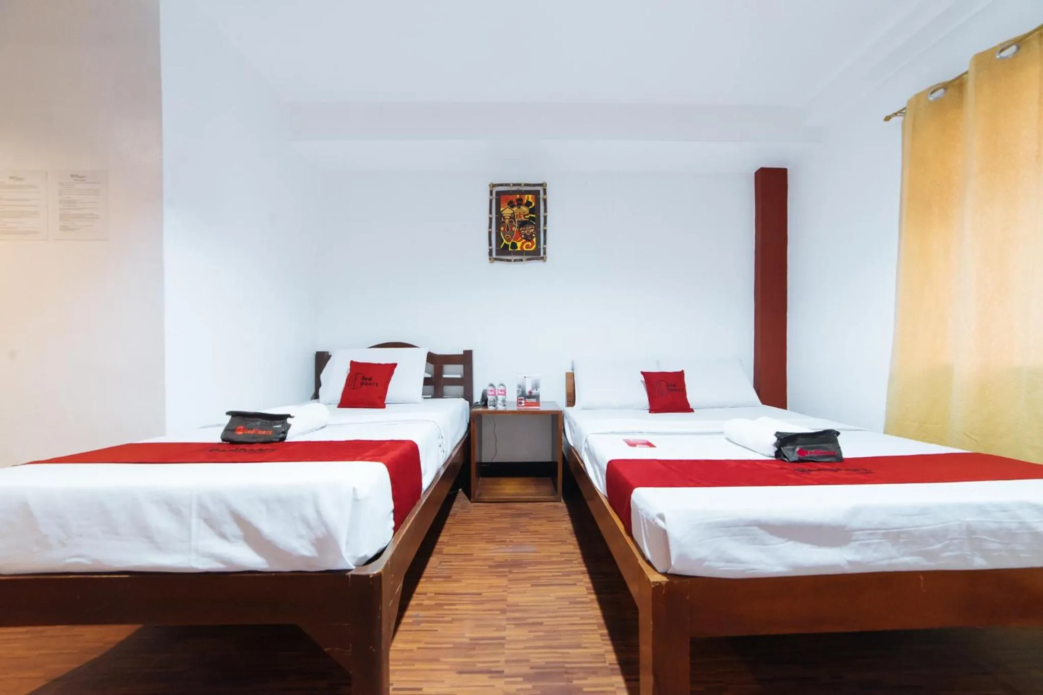Bed in RedDoorz at Nirvana Pension House