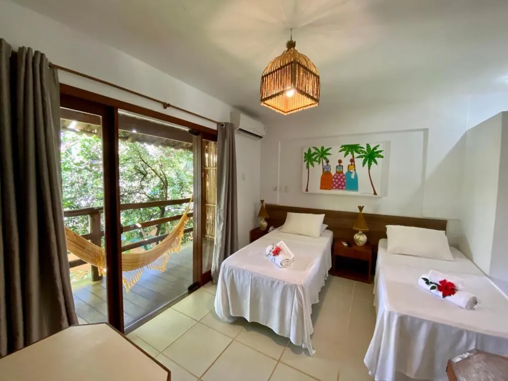 Bed in Pousada Vila do Dengo