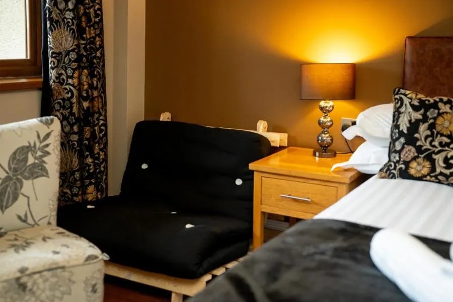 Seating area, Bed in The Gower Hotel