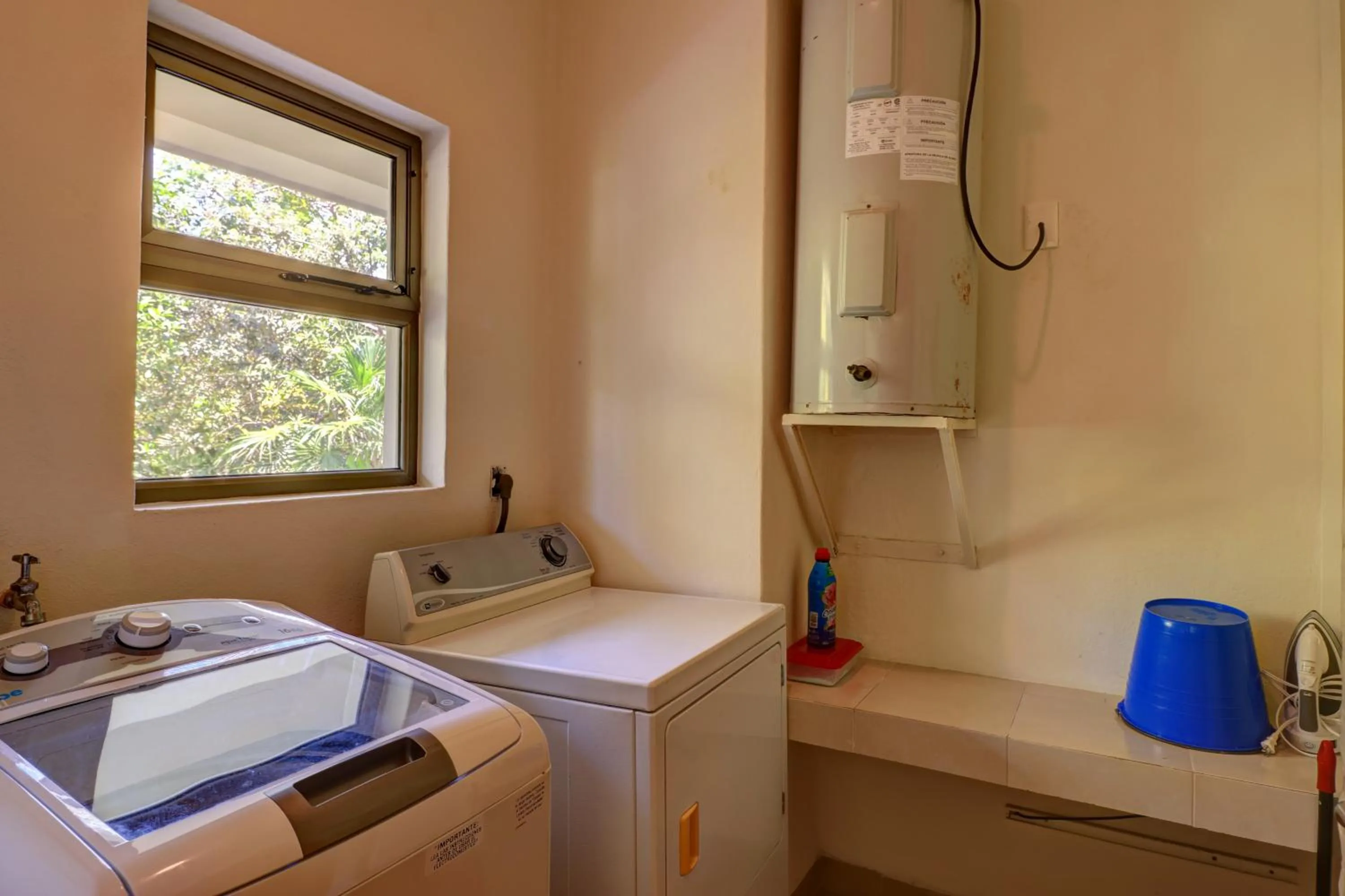 washing machine in Riviera Maya Suites