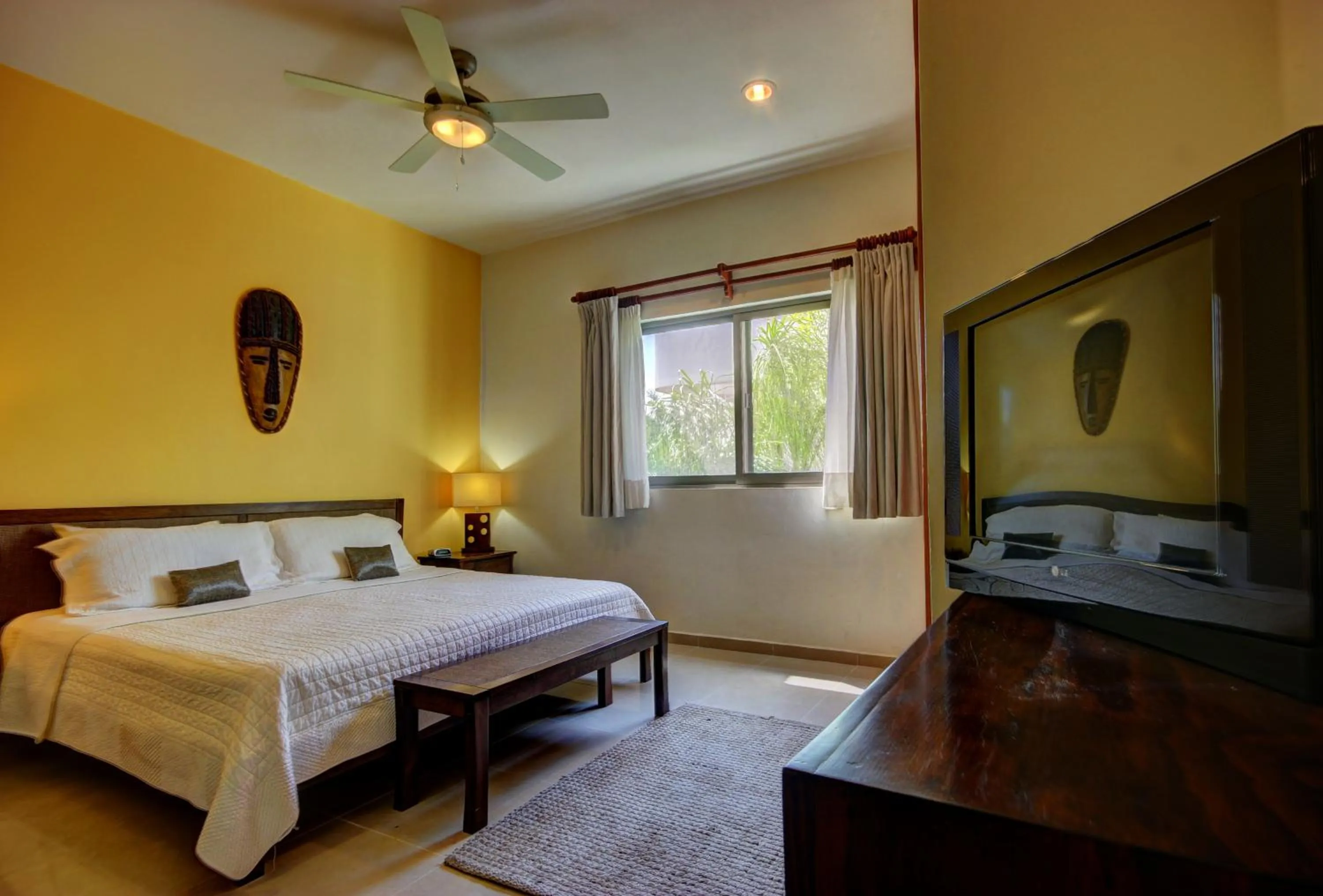 Bed in Riviera Maya Suites