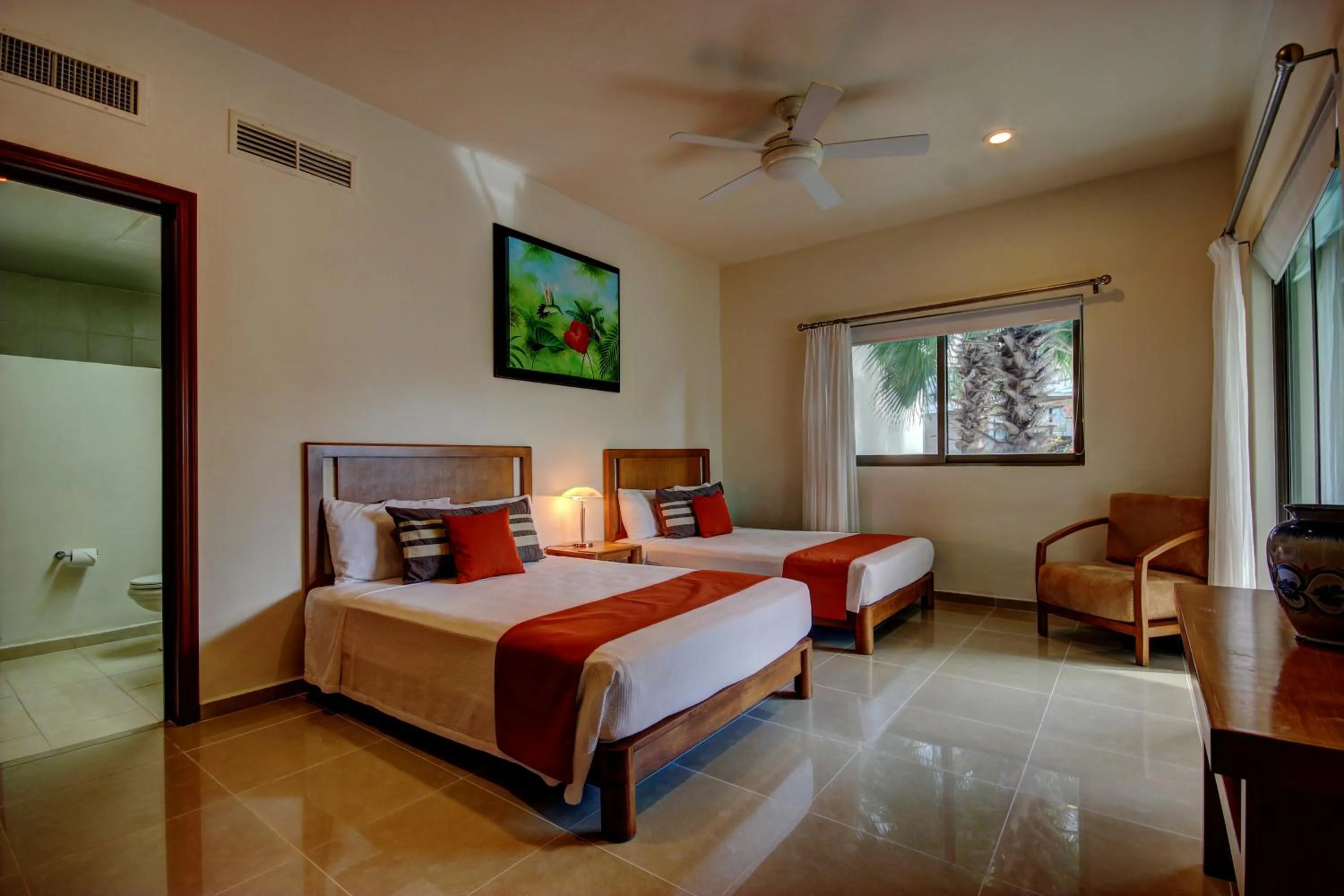 Bed in Riviera Maya Suites
