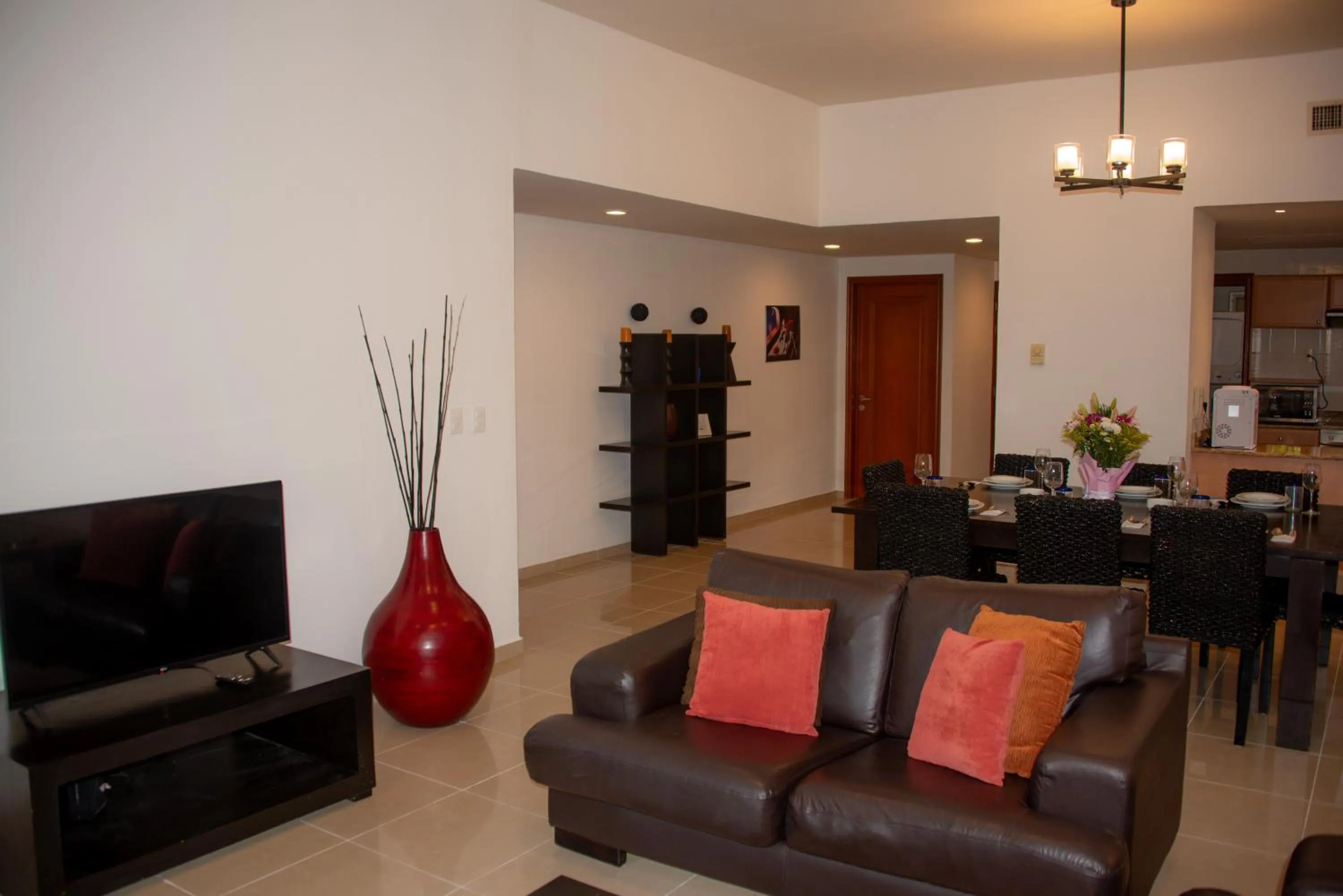 Communal lounge/ TV room in Riviera Maya Suites