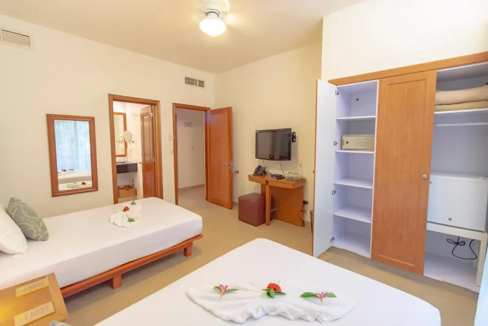 Bedroom, Bed in Riviera Maya Suites