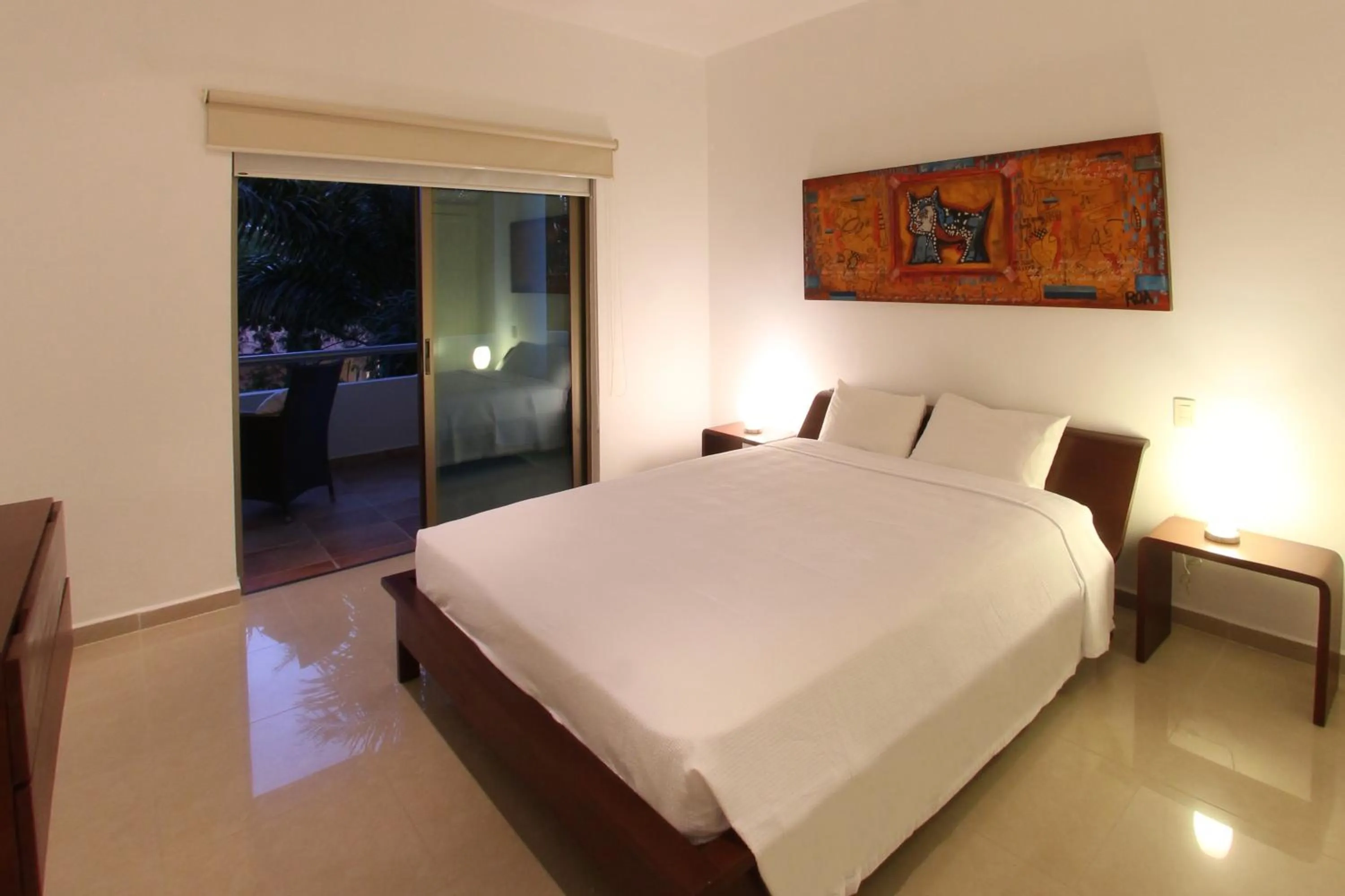Bed in Riviera Maya Suites