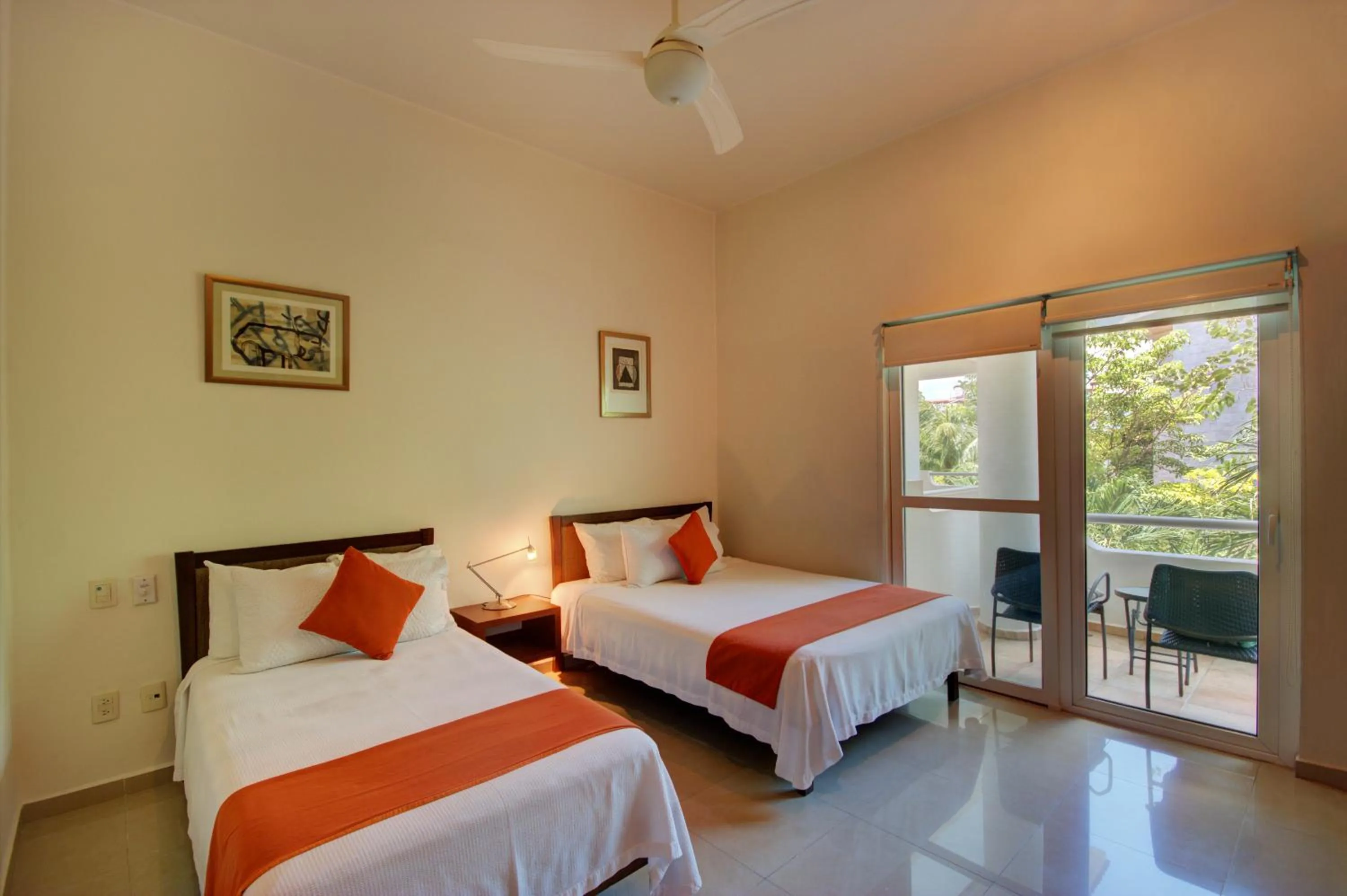 Bed in Riviera Maya Suites