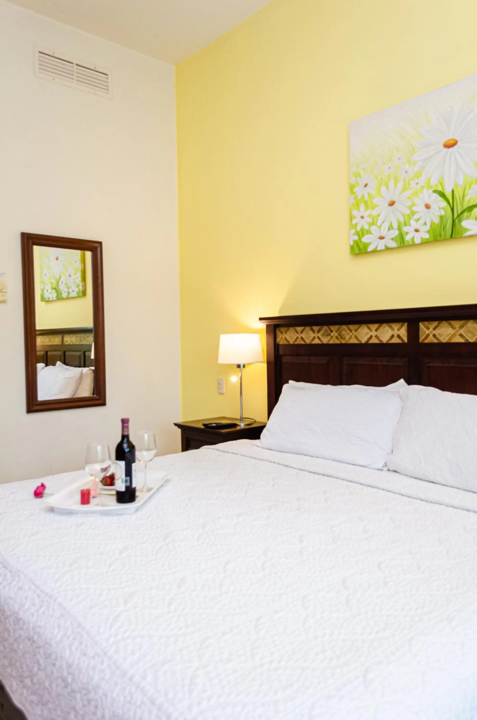 Bed in Riviera Maya Suites