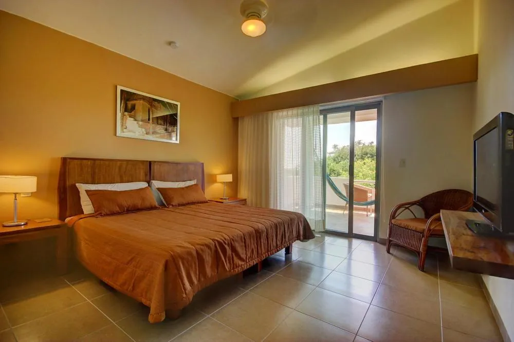 Bed in Riviera Maya Suites