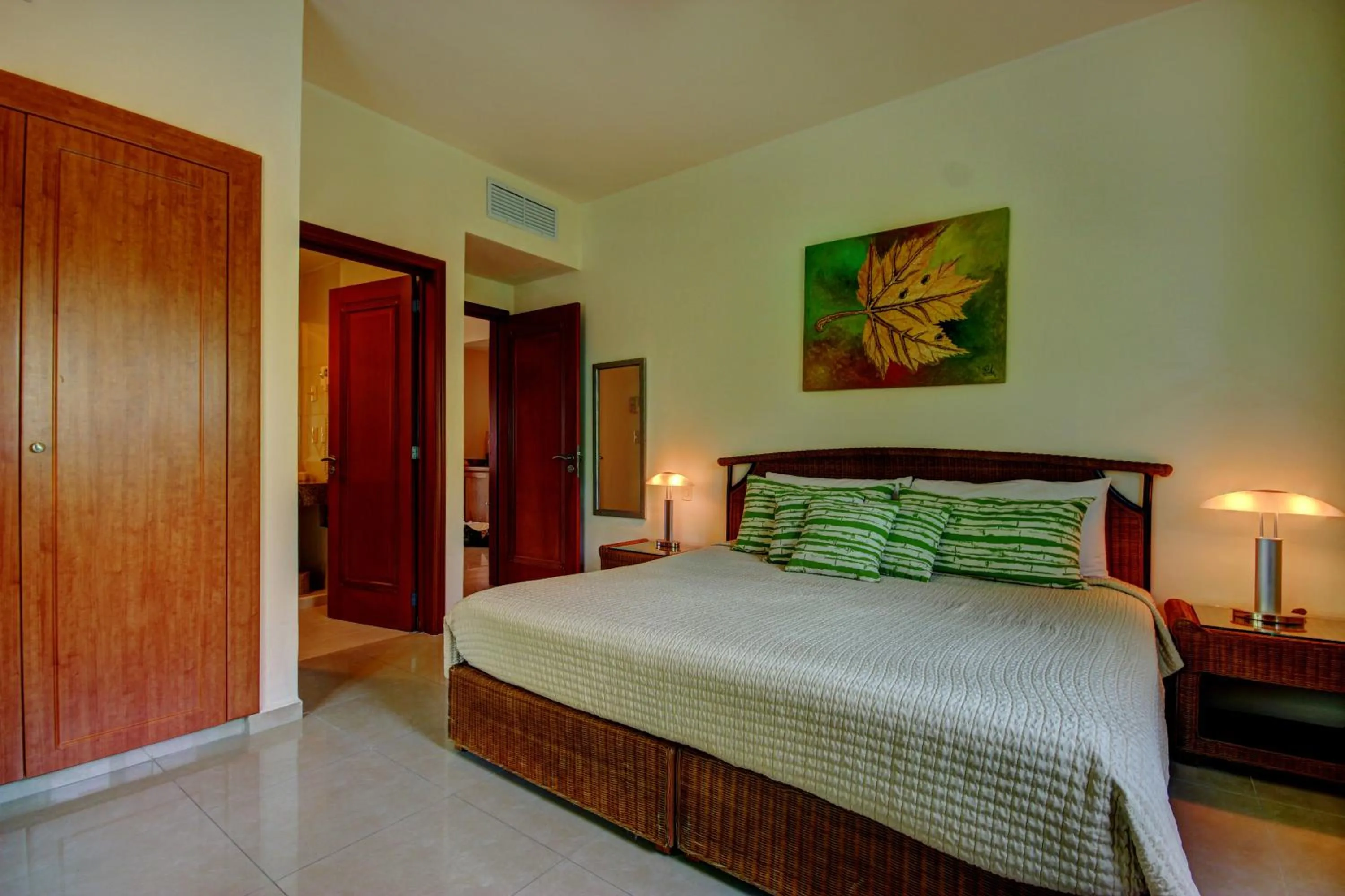 Bed in Riviera Maya Suites