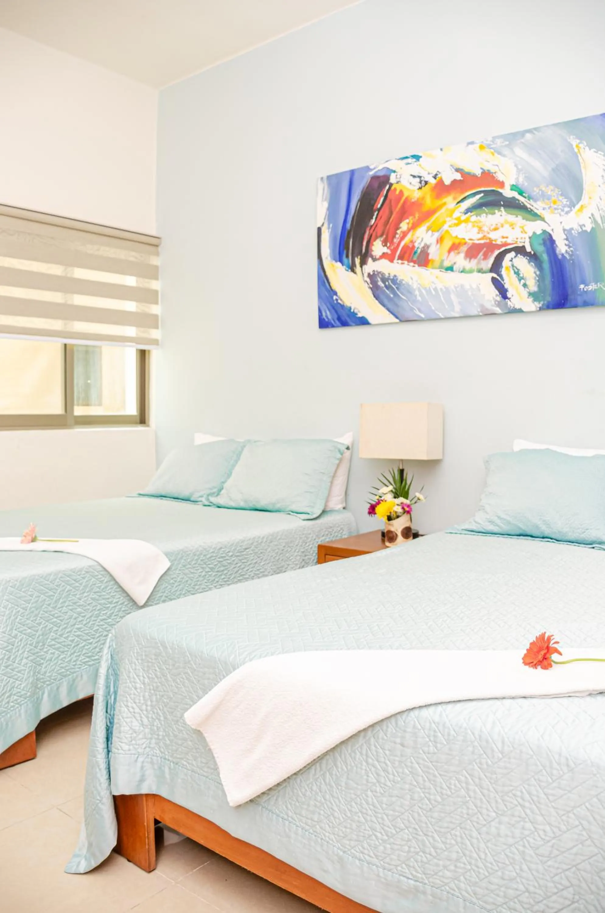 Bed in Riviera Maya Suites