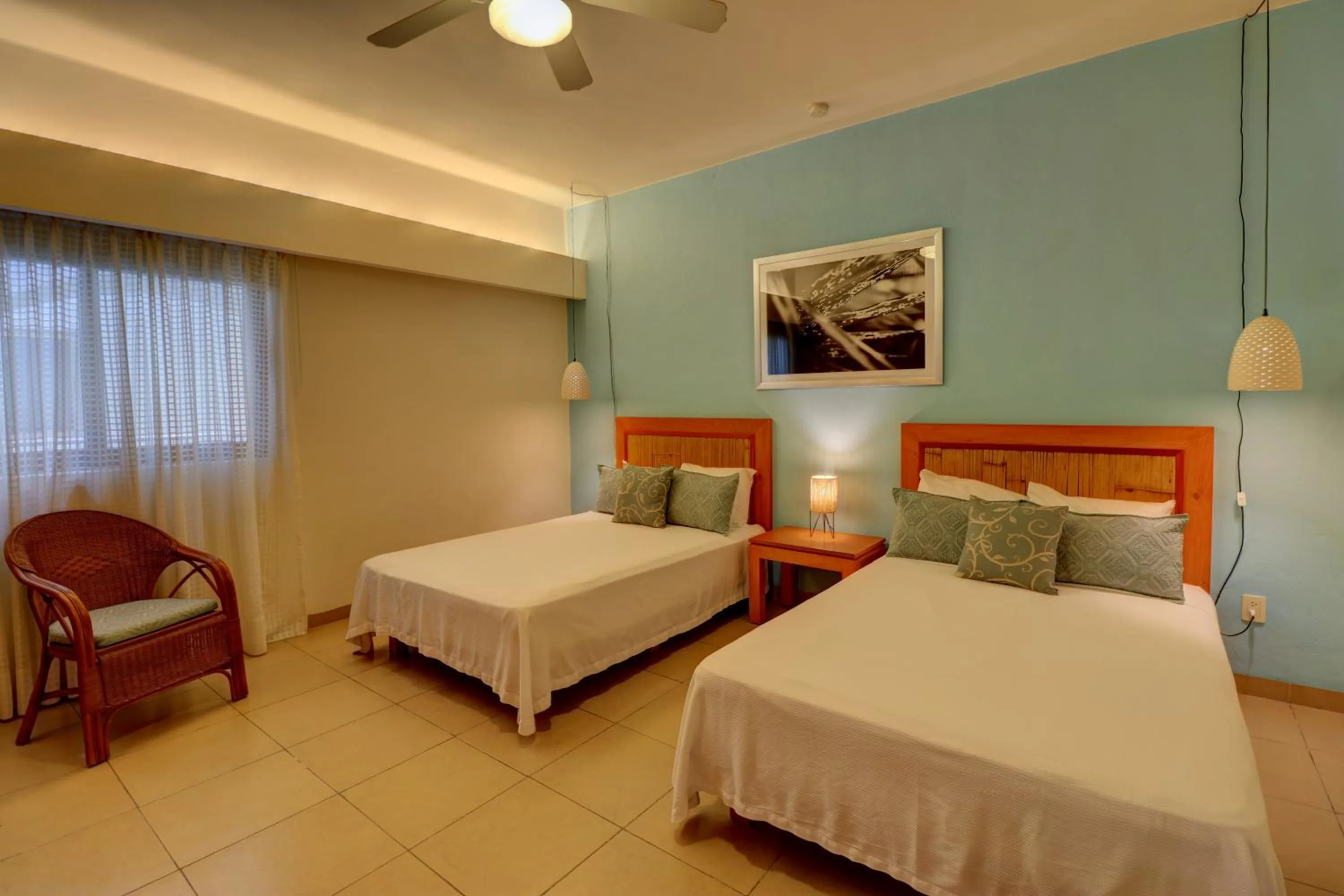 Bed in Riviera Maya Suites