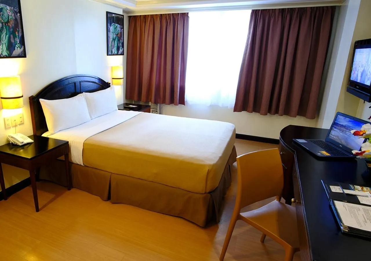 Bed in Fersal Hotel Neptune Makati