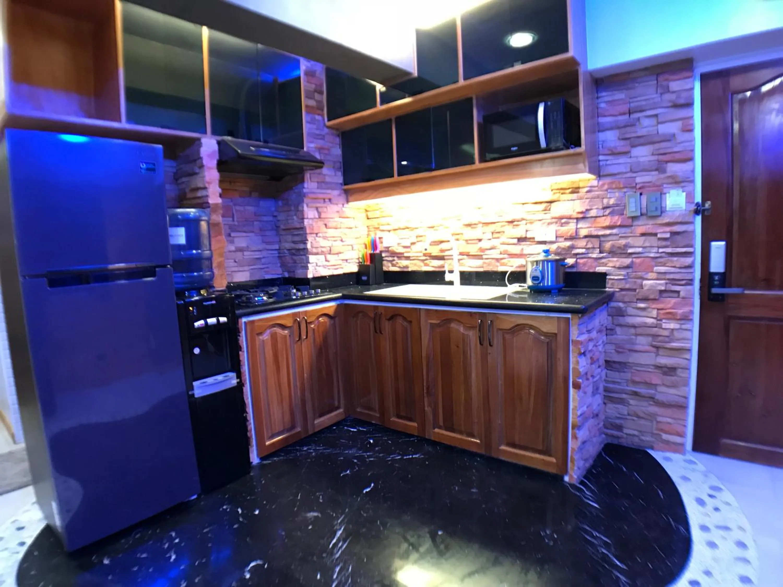 kitchen in CLOCKWORKORANGE Luxury Suites