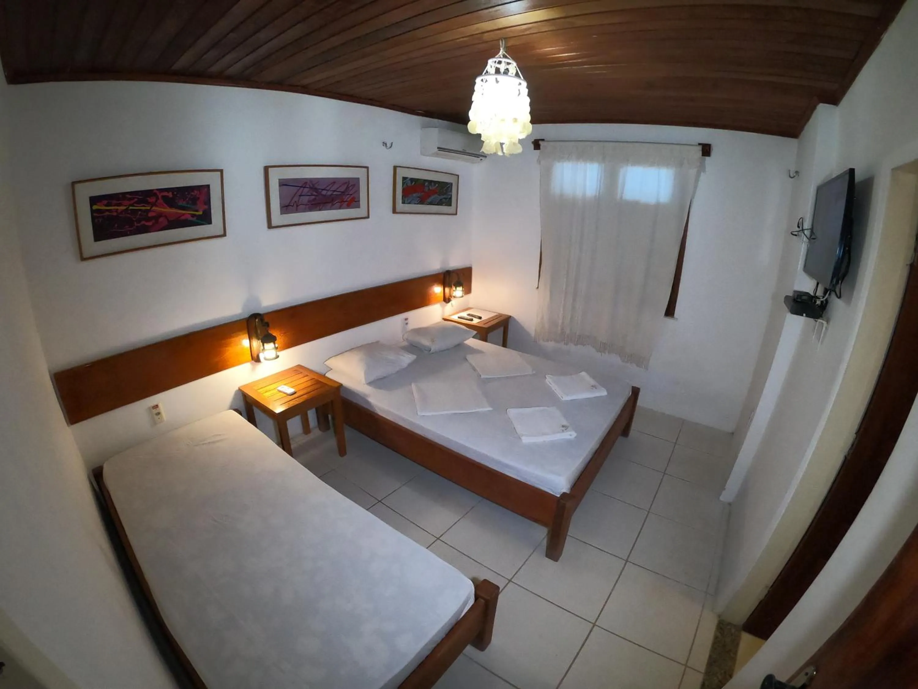 Bed in Pousada Casa Do Angelo