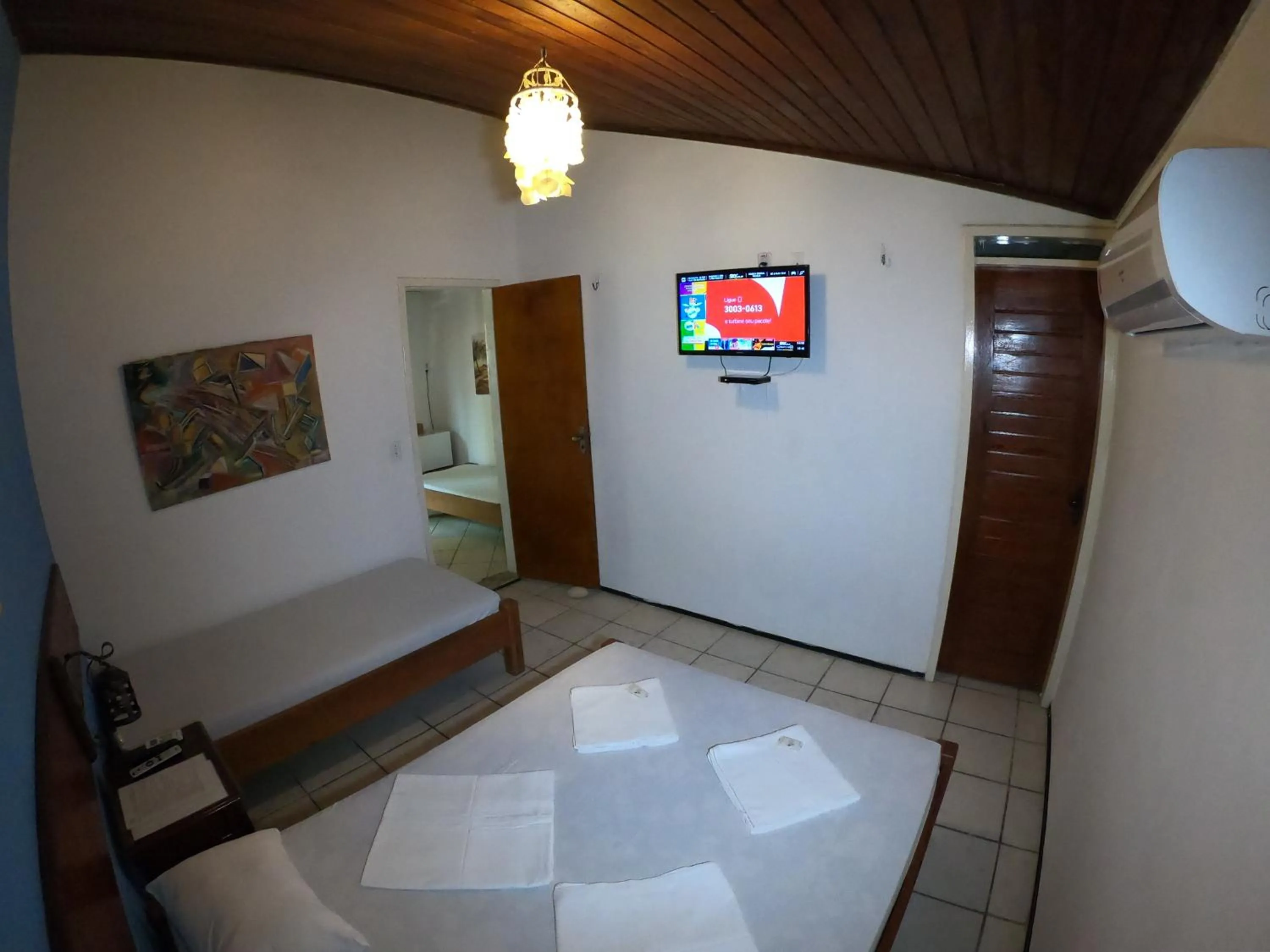 Bed in Pousada Casa Do Angelo