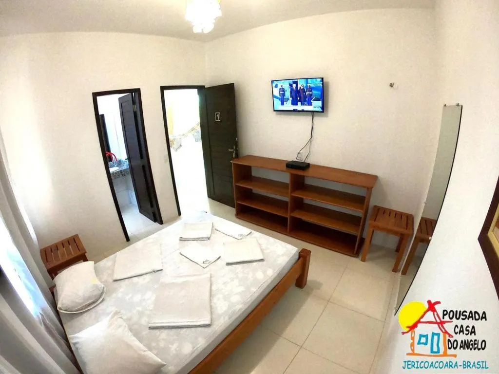 Bed in Pousada Casa Do Angelo