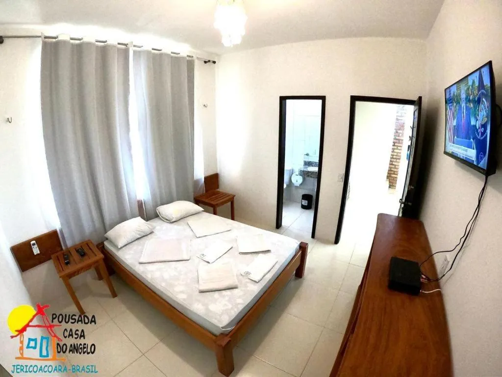 Bed in Pousada Casa Do Angelo