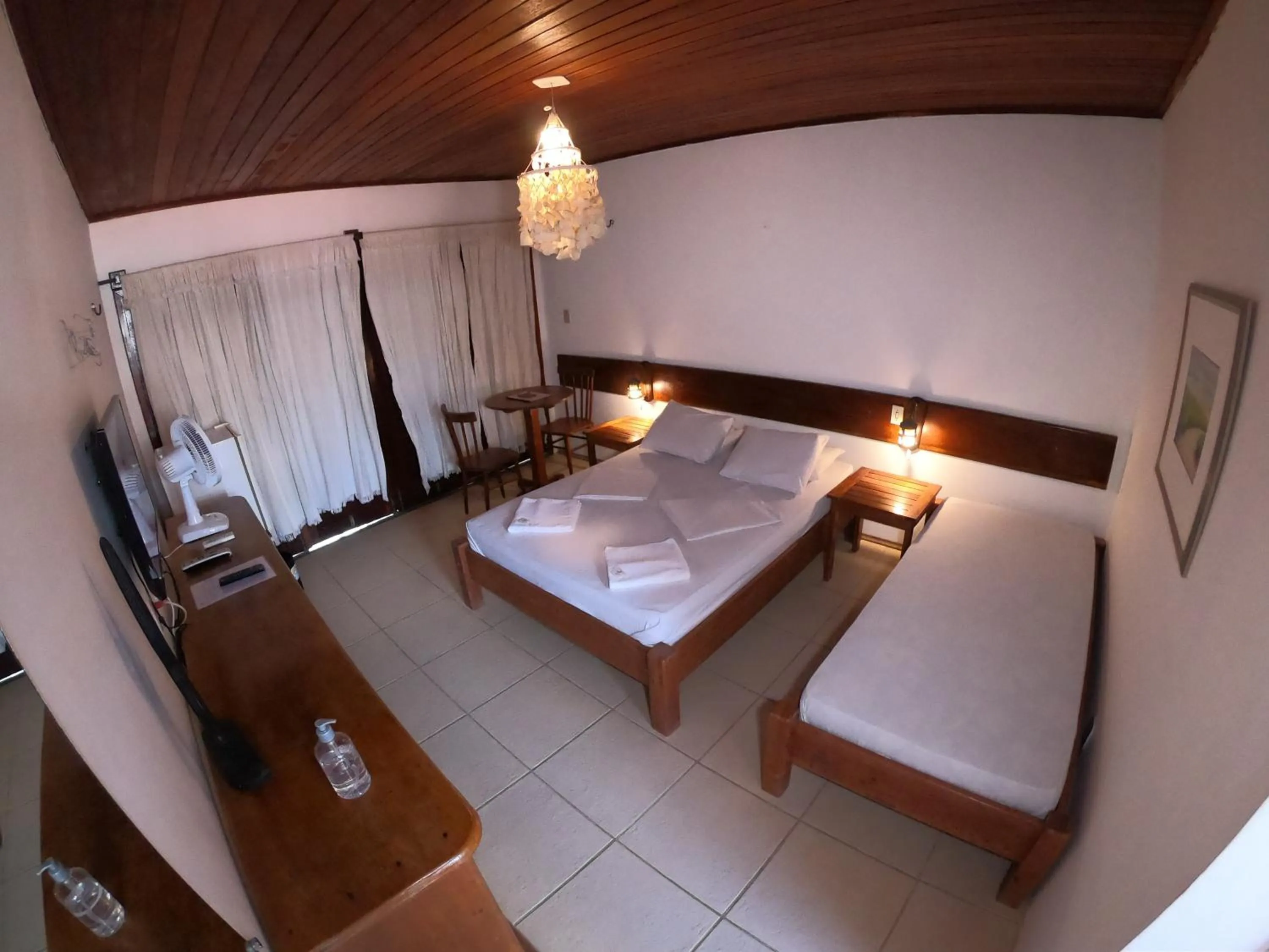 Bed in Pousada Casa Do Angelo