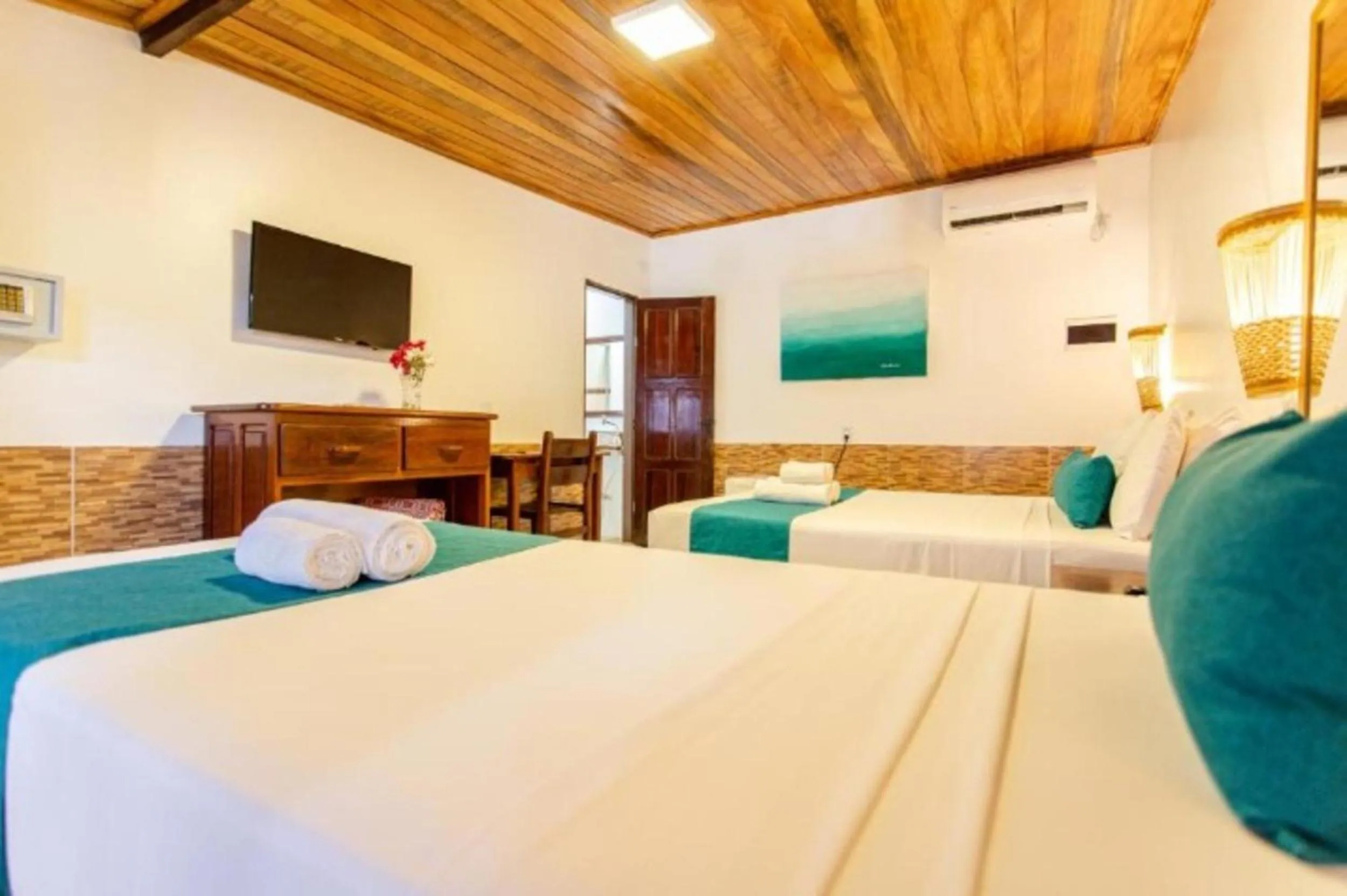 Bed in Pousada Capitão Thomaz