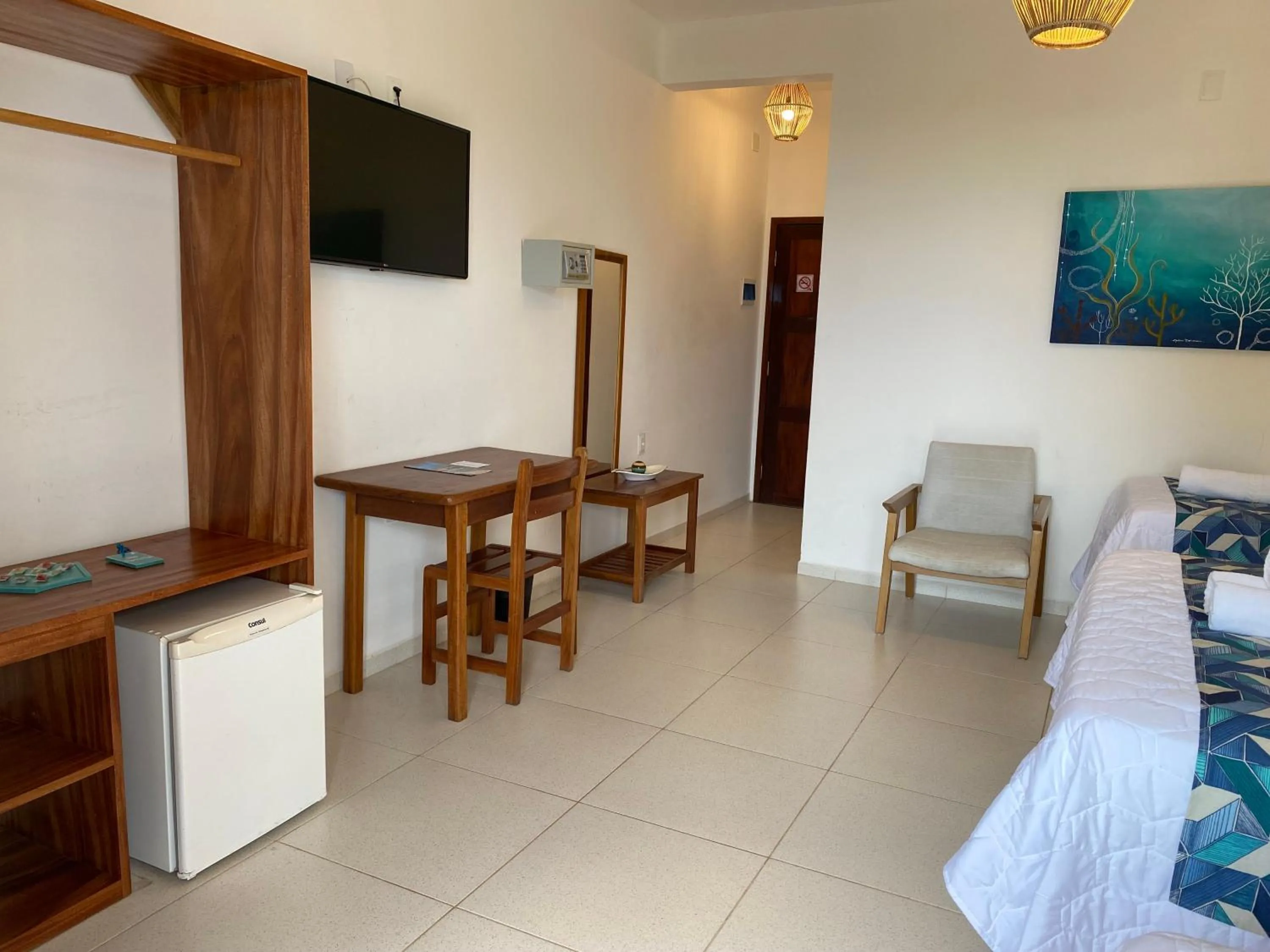 Communal lounge/ TV room, Bed in Pousada Capitão Thomaz