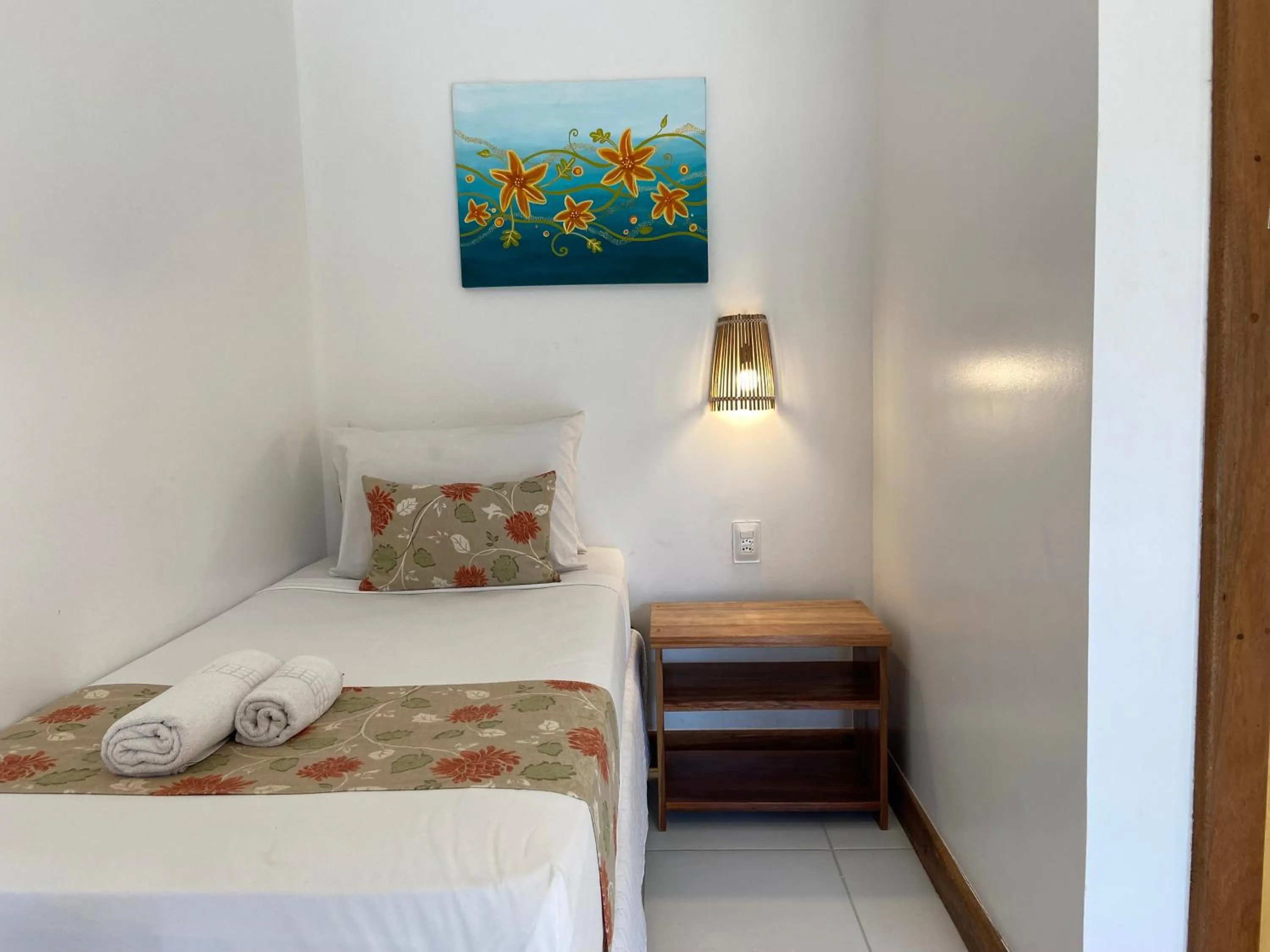 Bed in Pousada Capitão Thomaz