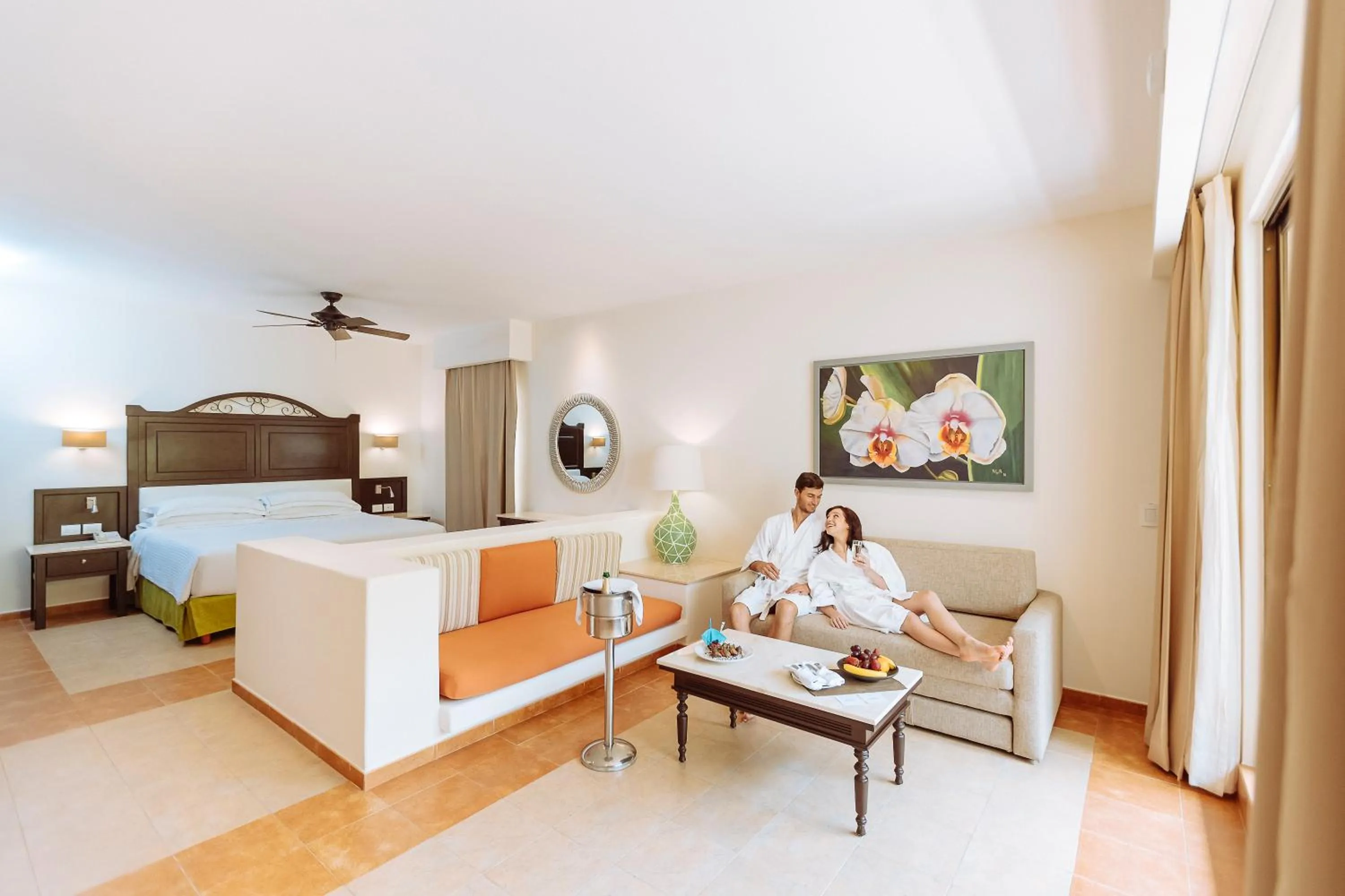 Living room, Bed in Occidental at Xcaret Destination - All Inclusive