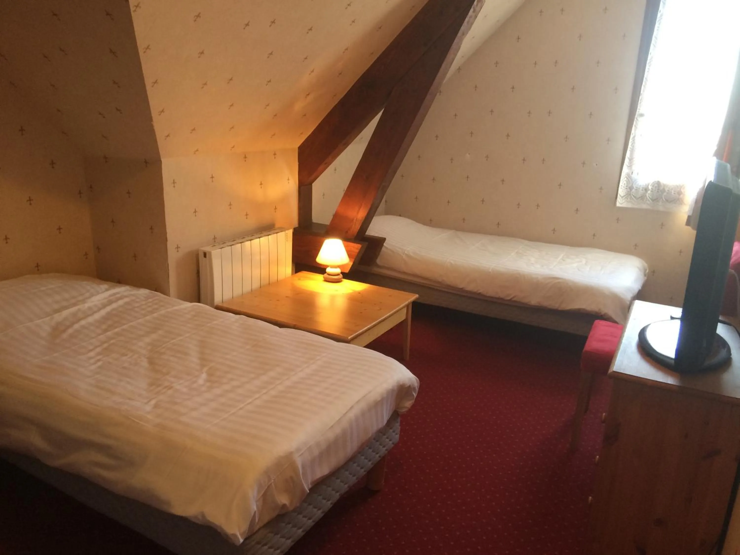 Bed in Auberge de la Petite Ferme, Super-Besse Est, The Originals Relais