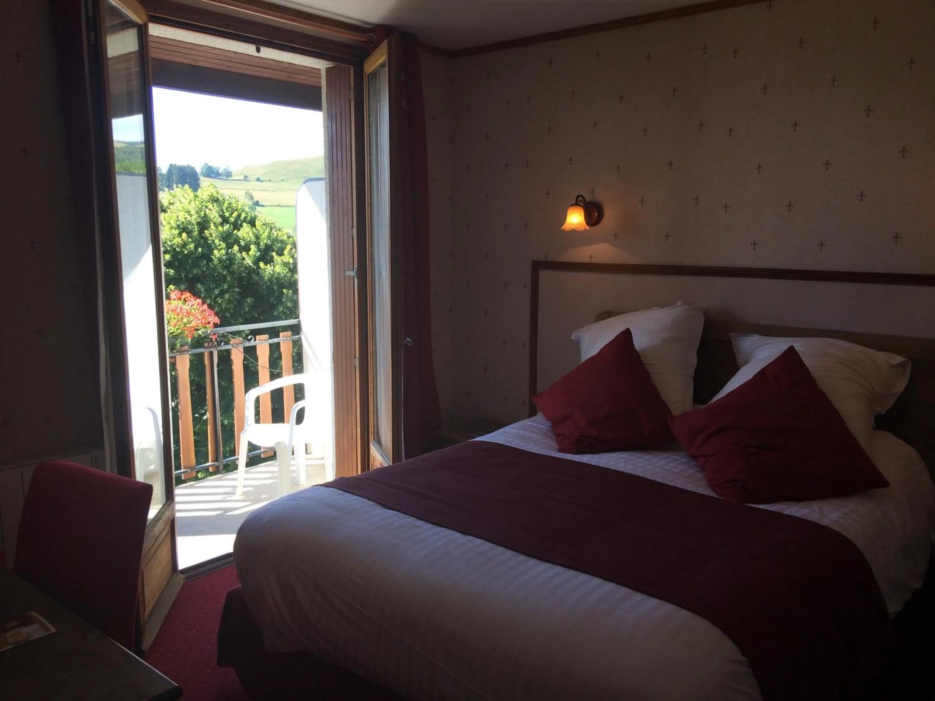 Bed in Auberge de la Petite Ferme, Super-Besse Est, The Originals Relais