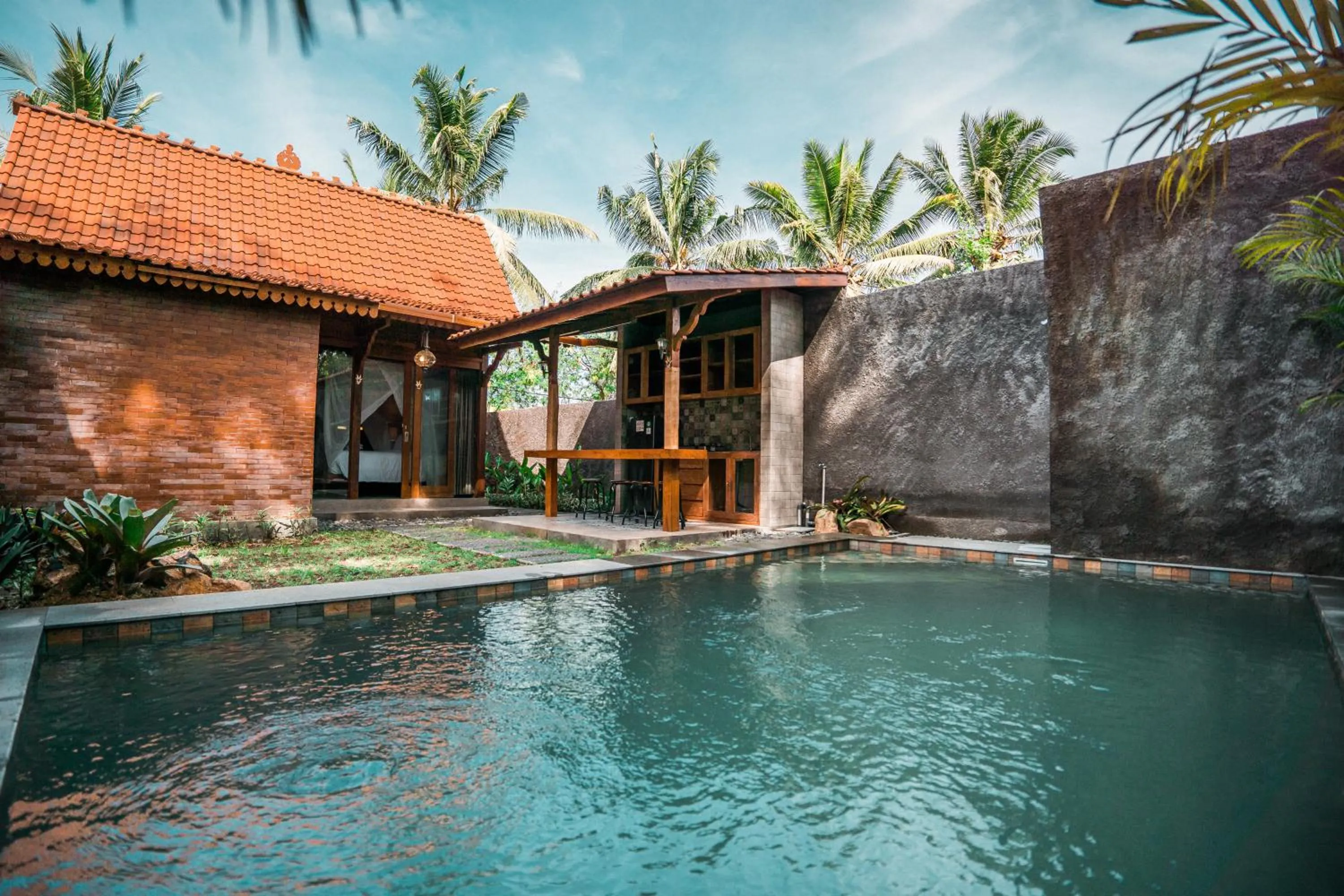 Swimming pool in Umadhatu Resort by Amerta