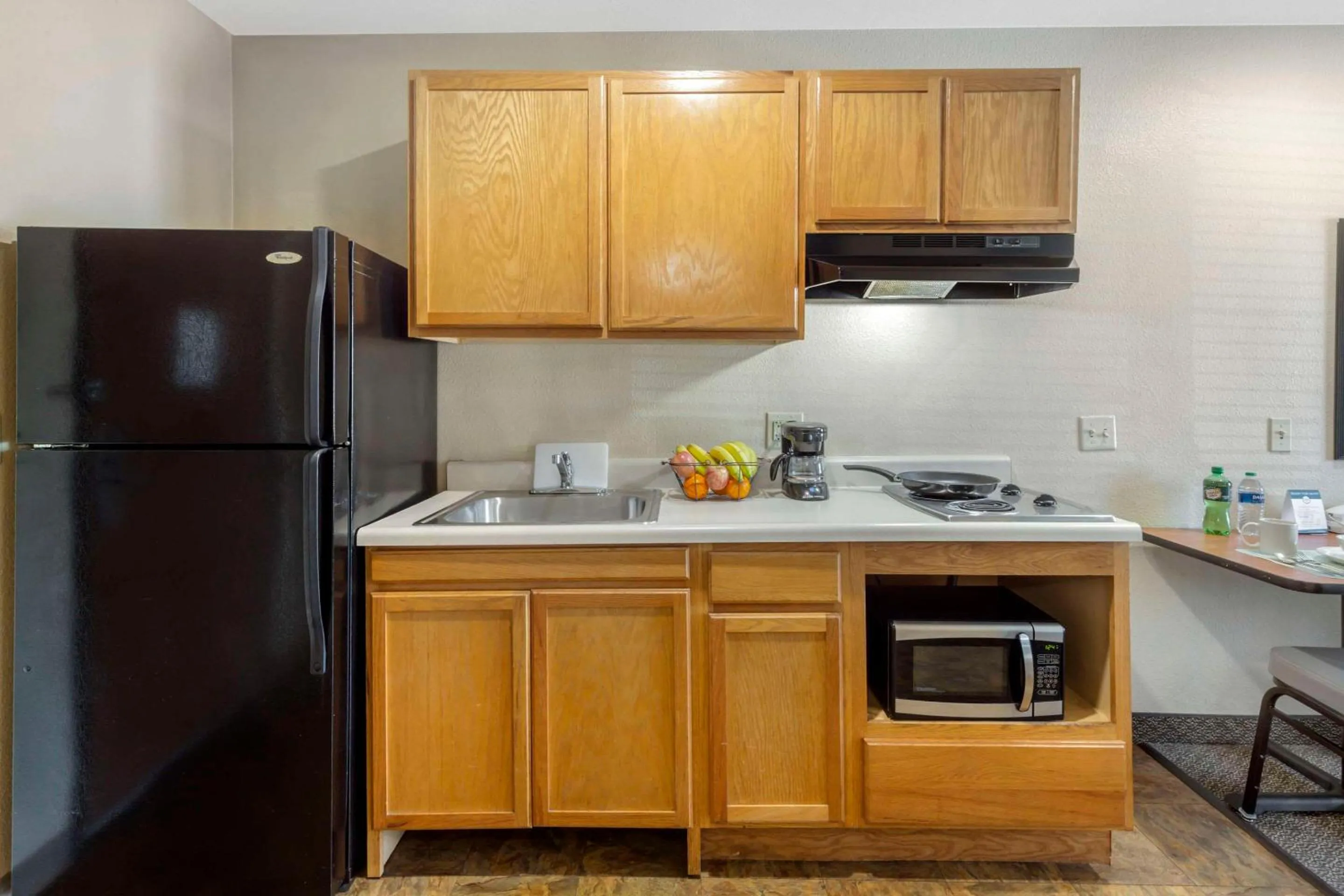 Bedroom in WoodSpring Suites Raleigh Garner