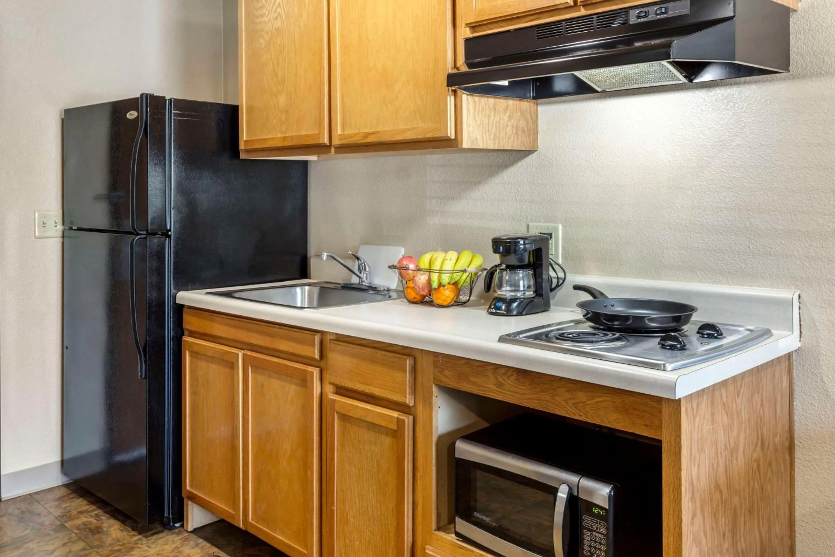 Bedroom in WoodSpring Suites Raleigh Garner