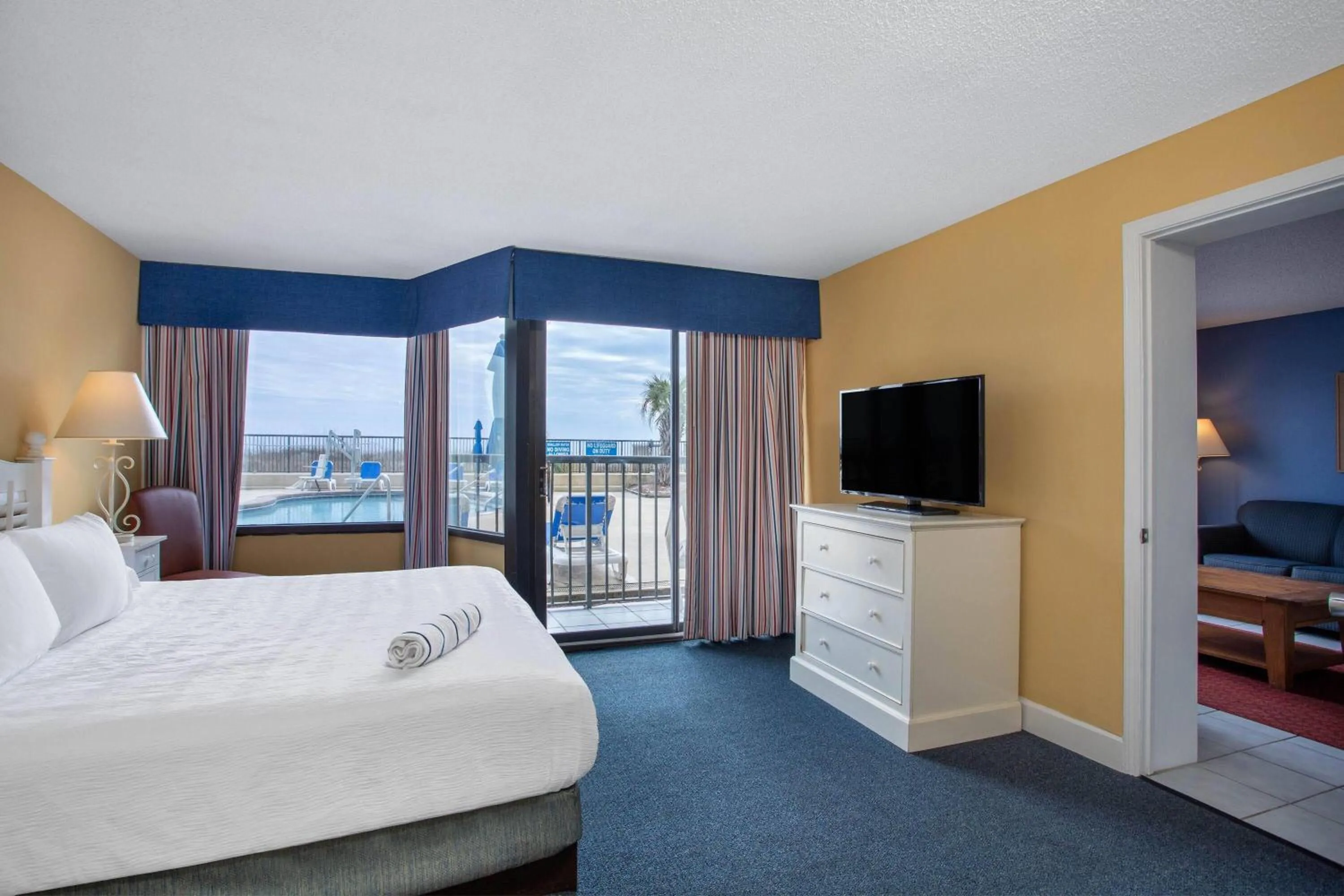 Photo of the whole room, Bed in Ocean Club Resort Myrtle Beach a Ramada by Wyndham