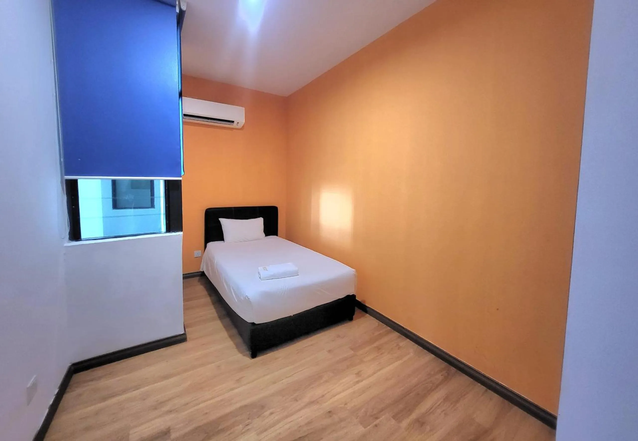 Bed in Roxy Hotel & Apartments