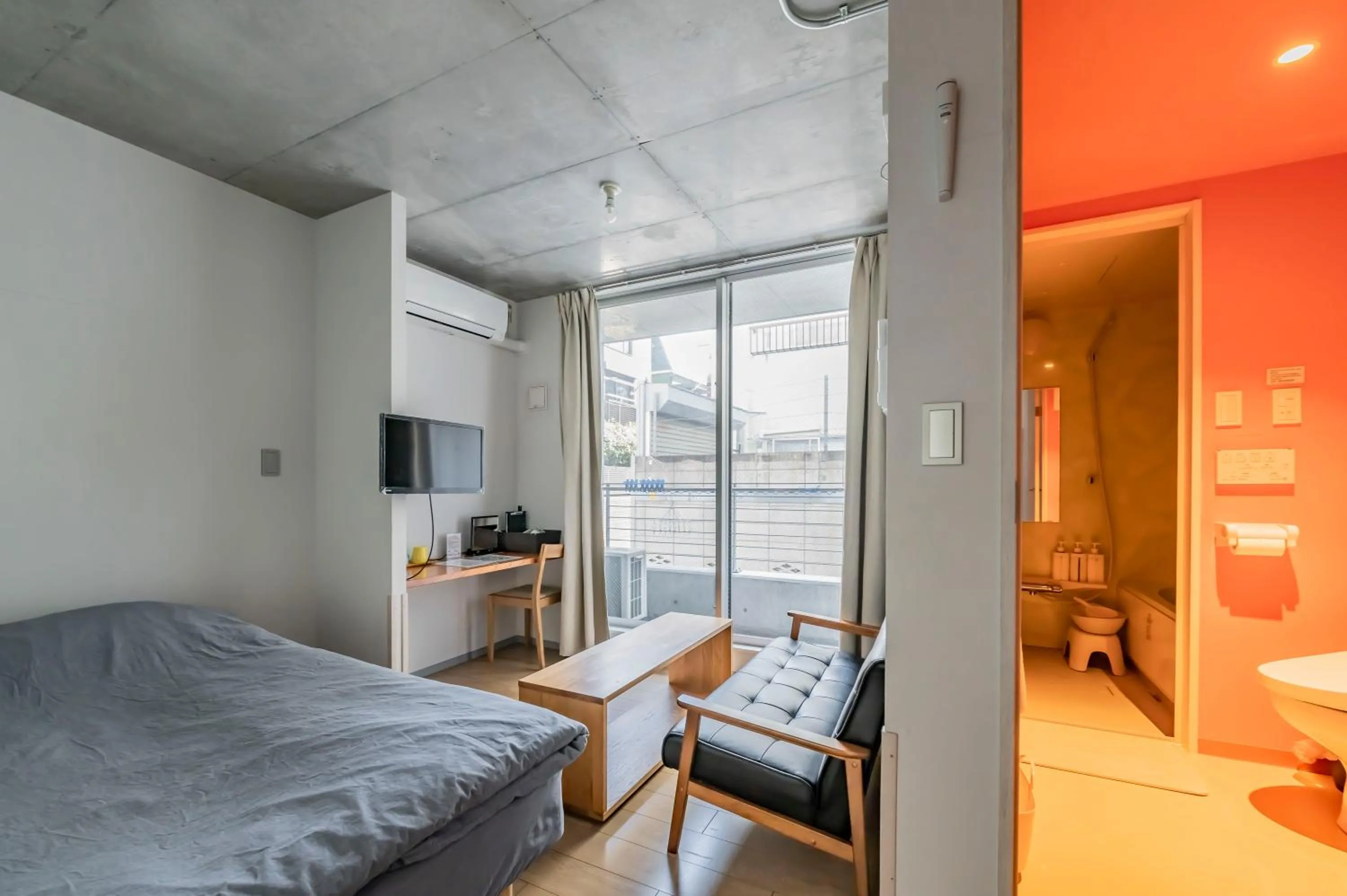 Living room, Bed in bmj Shinjuku Okubo