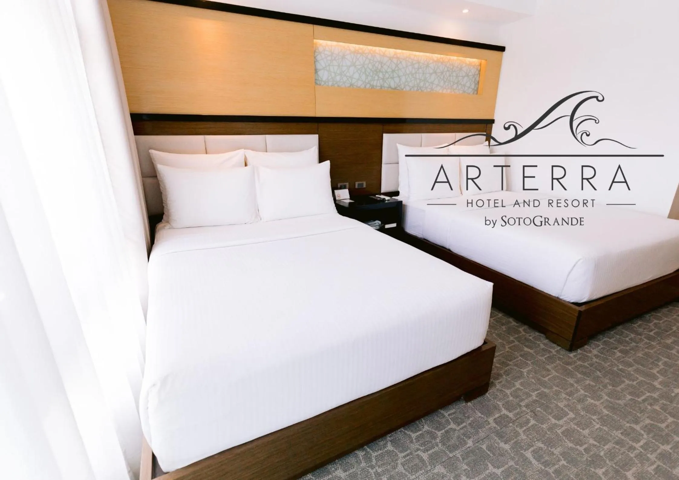 Bed in Arterra Hotel and Resort