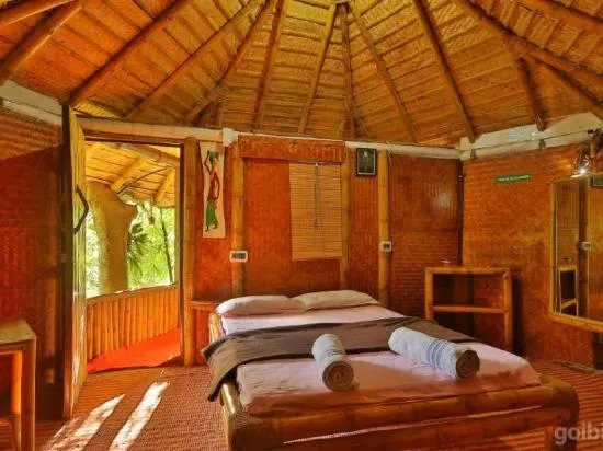 Bed in KOOMANKOLLY RESORT